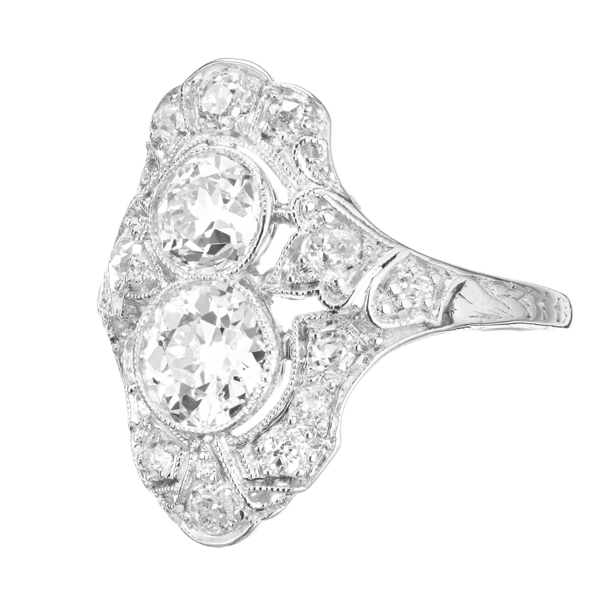 Double diamond engagement ring. 2 EGL certified Old European cut center stones totaling 1.16 carats set in a platinum handmade friligree setting, accented with 14 old mine cut diamonds. The ring dates back to the late Edwardian era, 1910. The two