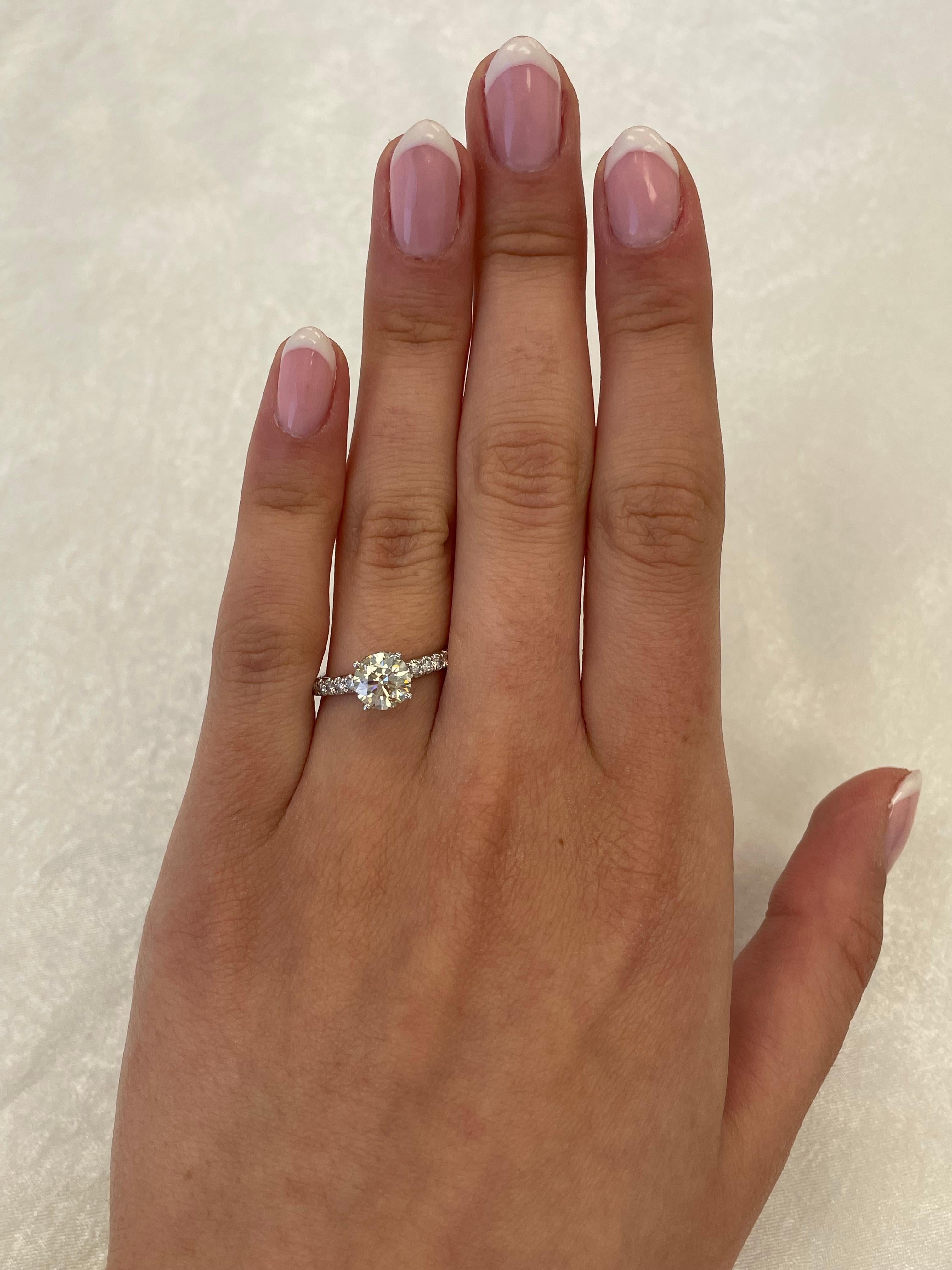 Classic solitaire diamond engagement ring with diamonds down the shank, EGL certified.
1.55 carats total diamond weight.
1.20 carat round brilliant diamond, EGL certified K color grade and SI3 clarity grade. Complimented by 0.35 carats of round