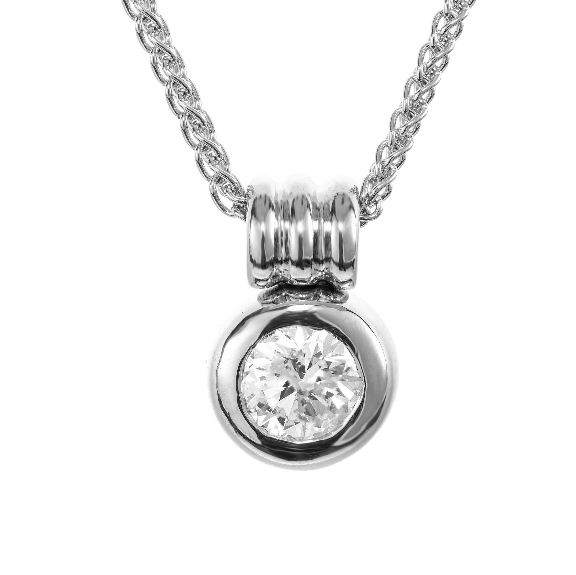 This EGL certified round brilliant cut 1.23ct diamond is in a bezel set 18k white gold setting. The diamond is bright and sparkly face-up with no flaws visible to the eye. The brilliance captures reflecting light from every angle. The sleek white
