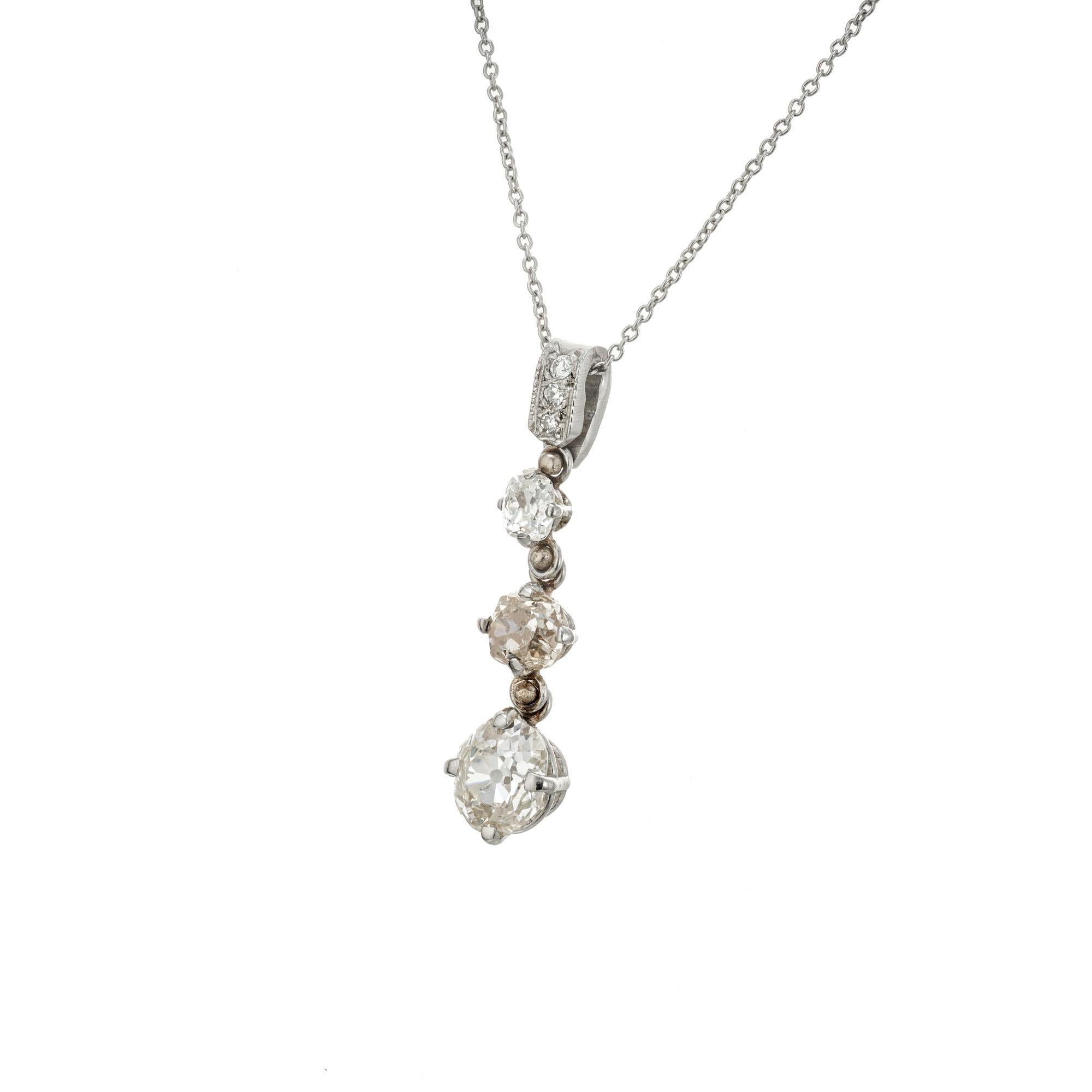 Handmade 3 stone pendant necklace. EGL certified .65 Old Mine cut diamond with 2 Old Mine cut diamonds above set in Platinum with a 16 inch chain and three diamond bail. Middle diamond is light brown and set sideways. circa 1880-1900. Later platinum