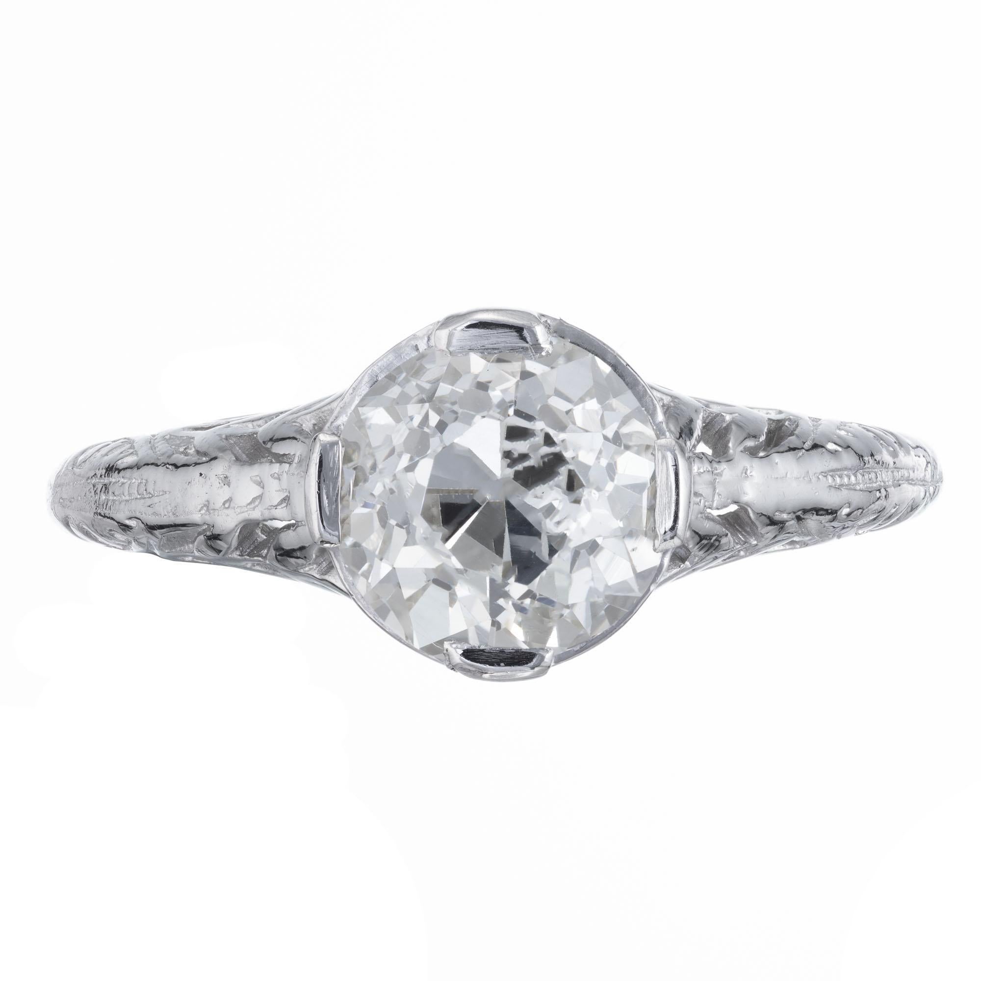 Art Nouveau diamond engagement ring. Handmade Platinum setting with an EGL certified old European cut center diamond.  ring circa 1900 with simple pierced design.   

1 old European cut diamond, approx. total weight 1.36cts, O to P color and VS1
