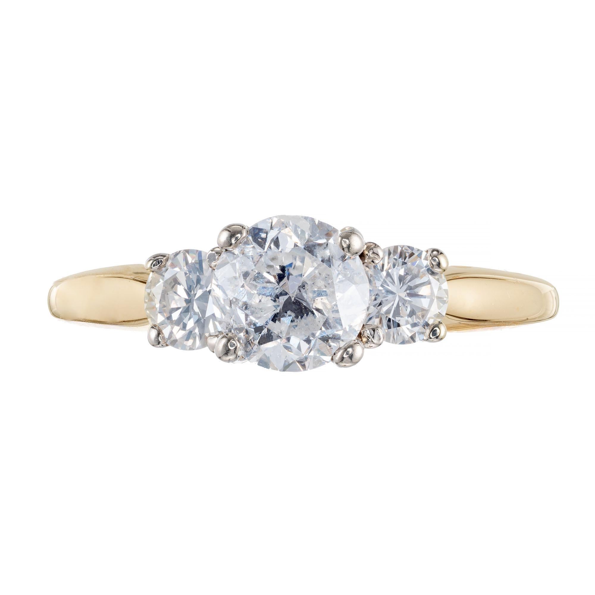 Diamond engagement ring. EGL certified center stone with 2 accent diamonds in a 14k yellow and white gold three-stone setting.

1 round brilliant cut diamond F-G I, approx. 1.00ct EGL Certificate # US400133357D 
2 round brilliant cut diamonds G-H