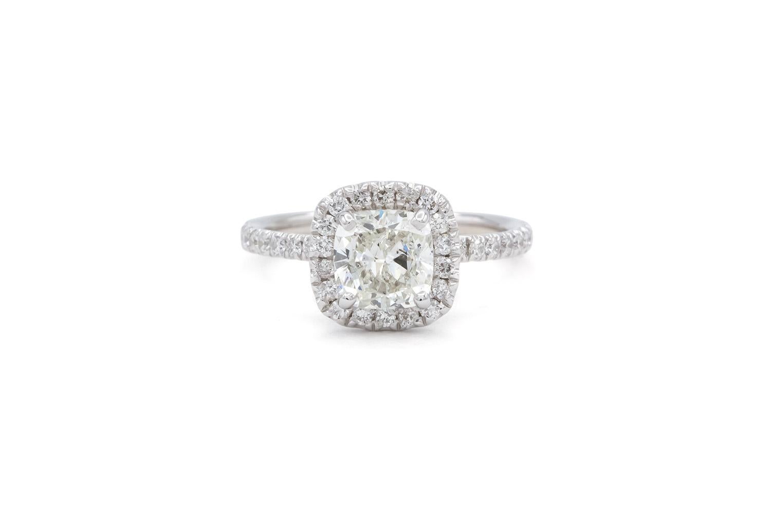 We are very pleased to present this remarkable EGL Certified & Laser Inscribed 14k White Gold & Cushion Cut Diamond Halo Engagement Ring. This stunning ring features a EGL Certified & Laser Inscribed 1.40ct G/SI2 Cushion Cut Diamond set in a 14k