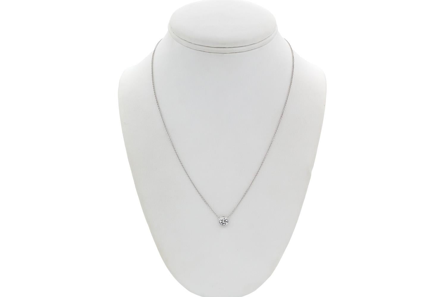We are pleased to present this EGL Certified 14k White Gold & Diamond Bezel Set Pendant Necklace. This cute piece features an EGL certified 0.93ct G/SI1 round brilliant cut diamond pendant bezel set on a 14k white gold chain. The chain is 18.25