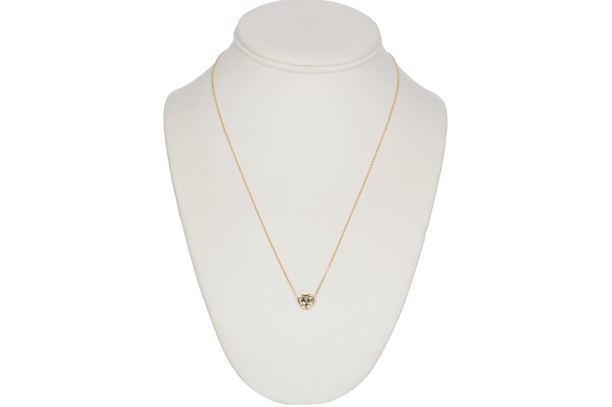 We are pleased to offer this brand new EGL Certified 14K Yellow Gold Diamond Heart Pendant Necklace. This gorgeous pendant is crafted from solid 14k yellow gold with an ELG USA certified bezel set 1.29ct O-P/VS1 heart brilliant cut diamond. The