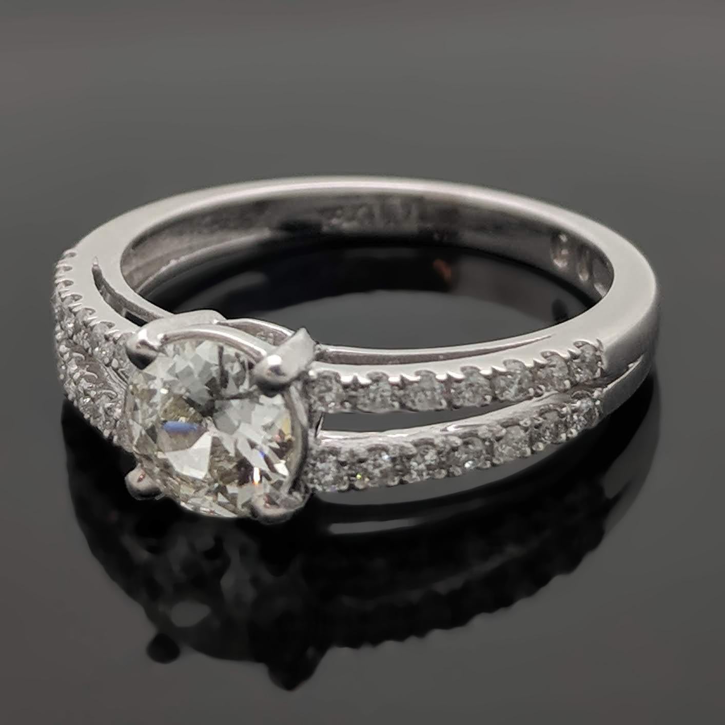 This 14kt white gold ring features a dazzling EGL Certified round brilliant-cut diamond estimated at 0.56ct in a 4 prong setting. A split shank is accented with diamonds at an estimated 0.21cttw. Estimated weight of gold is 1 gr.

We will size it