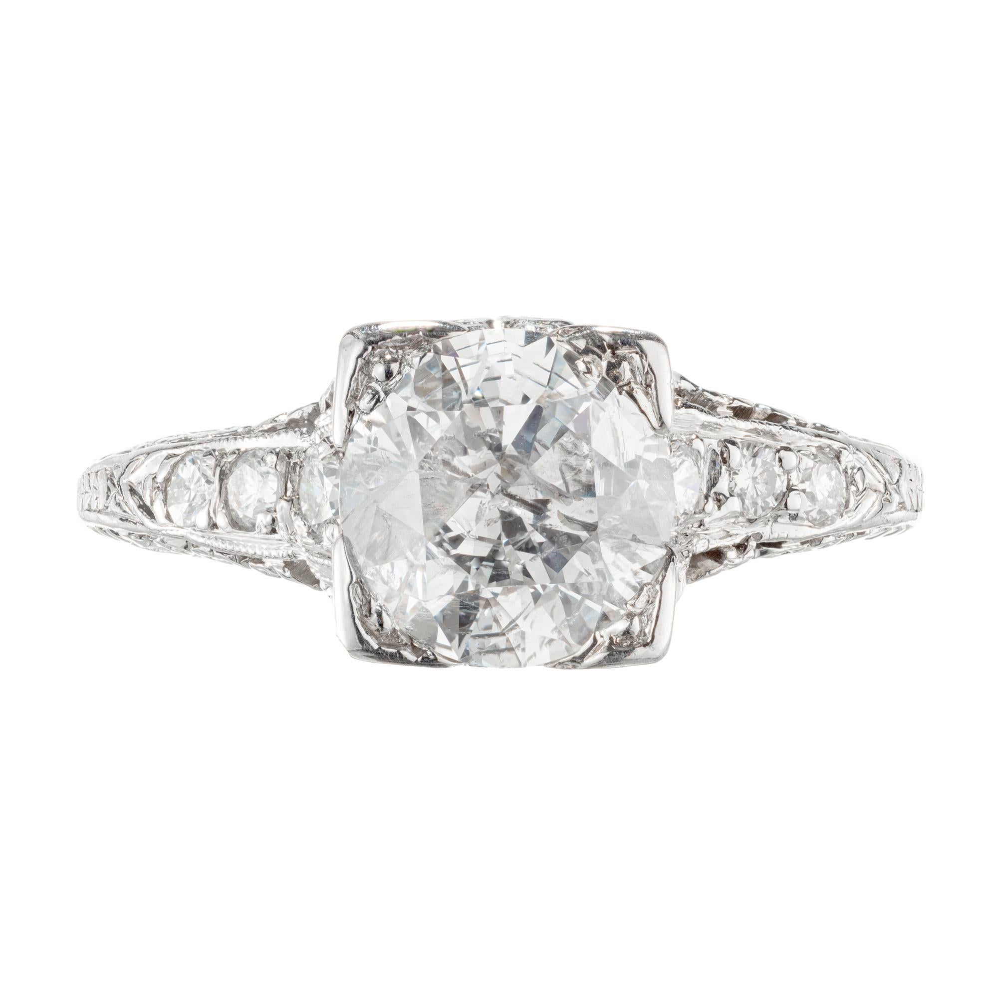 1930's diamond platinum ring. EGL certified transitional cut center stone with six round brilliant cut accent diamonds. . Recently graded by the EGL as fracture filled. 

1 round brilliant cut diamond, approx. 1.56cts F-G I2 EGL Certificate # US