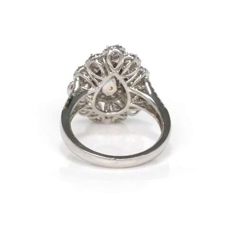 EGL Certified 1.58 Carat Pear Shape Vivid Fancy Yellow Diamond Engagement Ring In New Condition For Sale In New York, NY