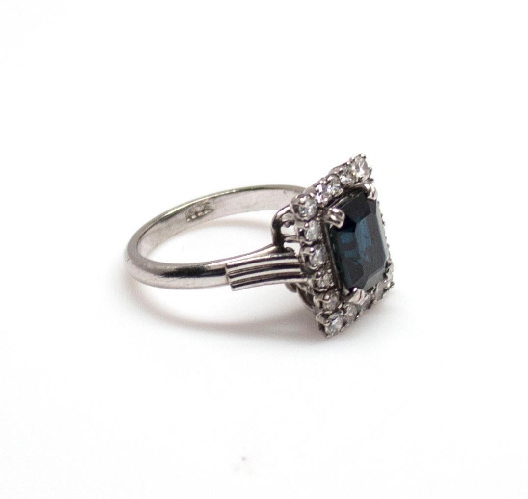 Emerald Cut EGL Certified 18 Karat 2.86 Carat Dark Blue Sapphire 1.14 Carat Diamond Ring For Sale
