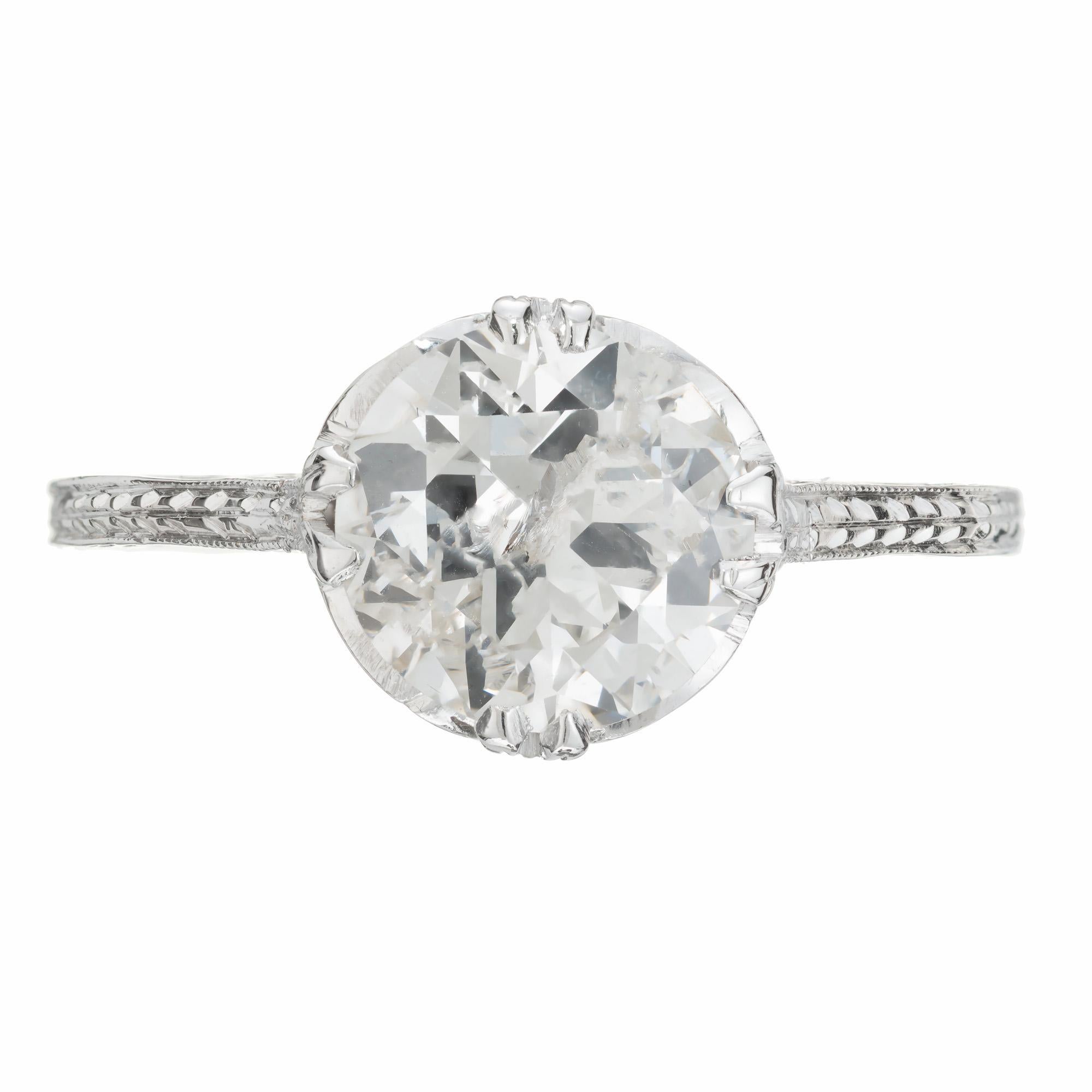 Transitional cut diamond engagement ring. EGL certified 1.80ct center stone set in a handmade 18k white gold engraved setting. Circa 1930's. 

1 transitional cut round diamond, H-I I2 approx. 1.80cts EGL Certificate # 400154749D
Size 6.25 and