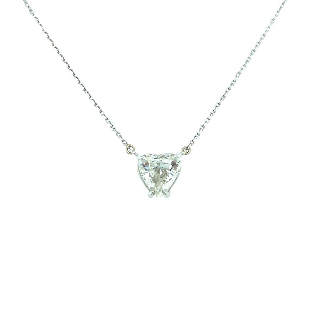 This minimalist 4 prong pendant showcases a beautiful EGL certified 2 carat diamond. The heart shape diamond sparkles in G color and VS 2 clarity.  The necklace measures 15 inch long. Crafted and finished by Gems Are Forever in Beverly Hills, CA.
