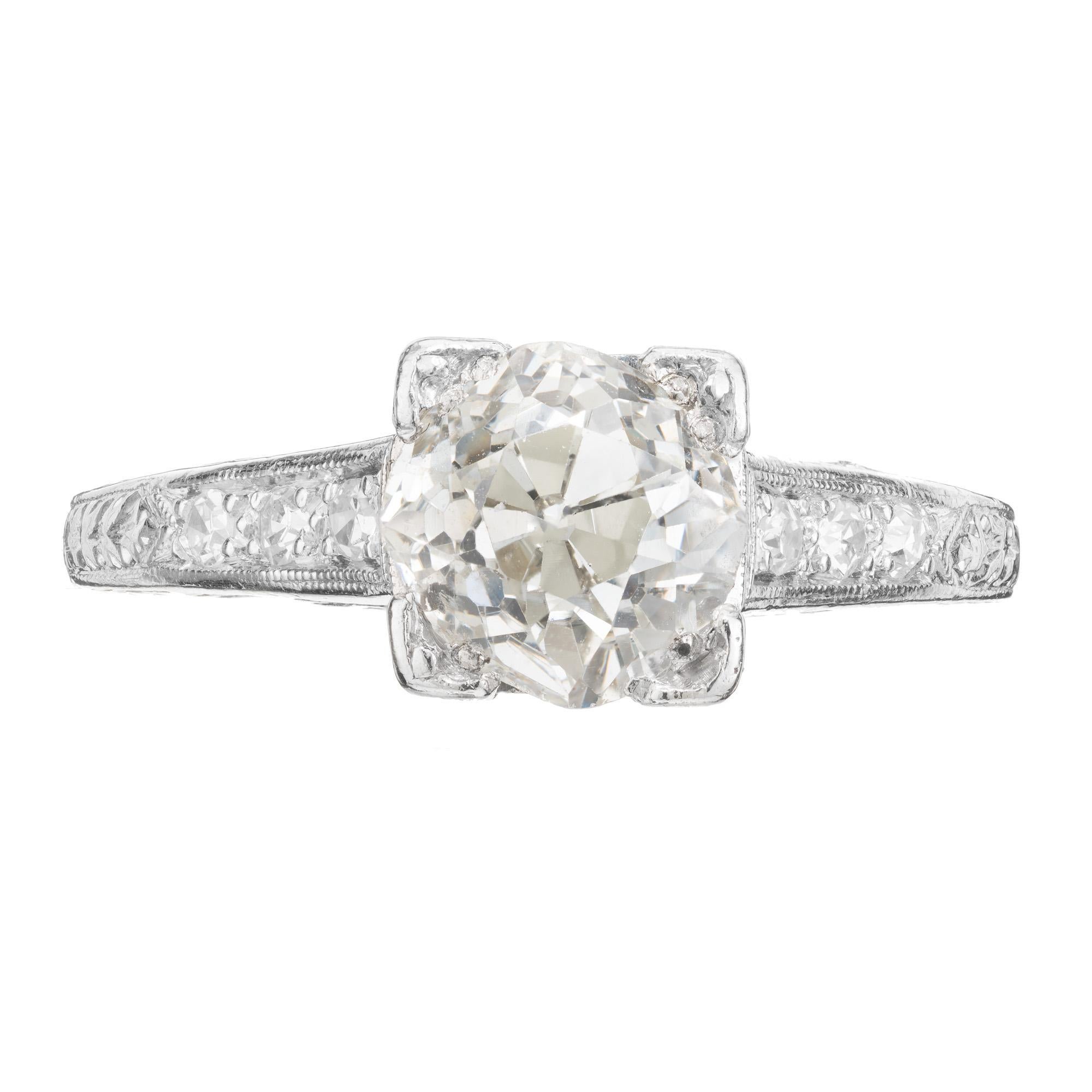 The center piece of this 1920's Art Deco engagement ring is a highly desirable 2.05ct old mine brilliant cut diamond. Graded by the EGL as I, near colorless. The setting is platinum and embraces the art deco style of the era and is adorned with