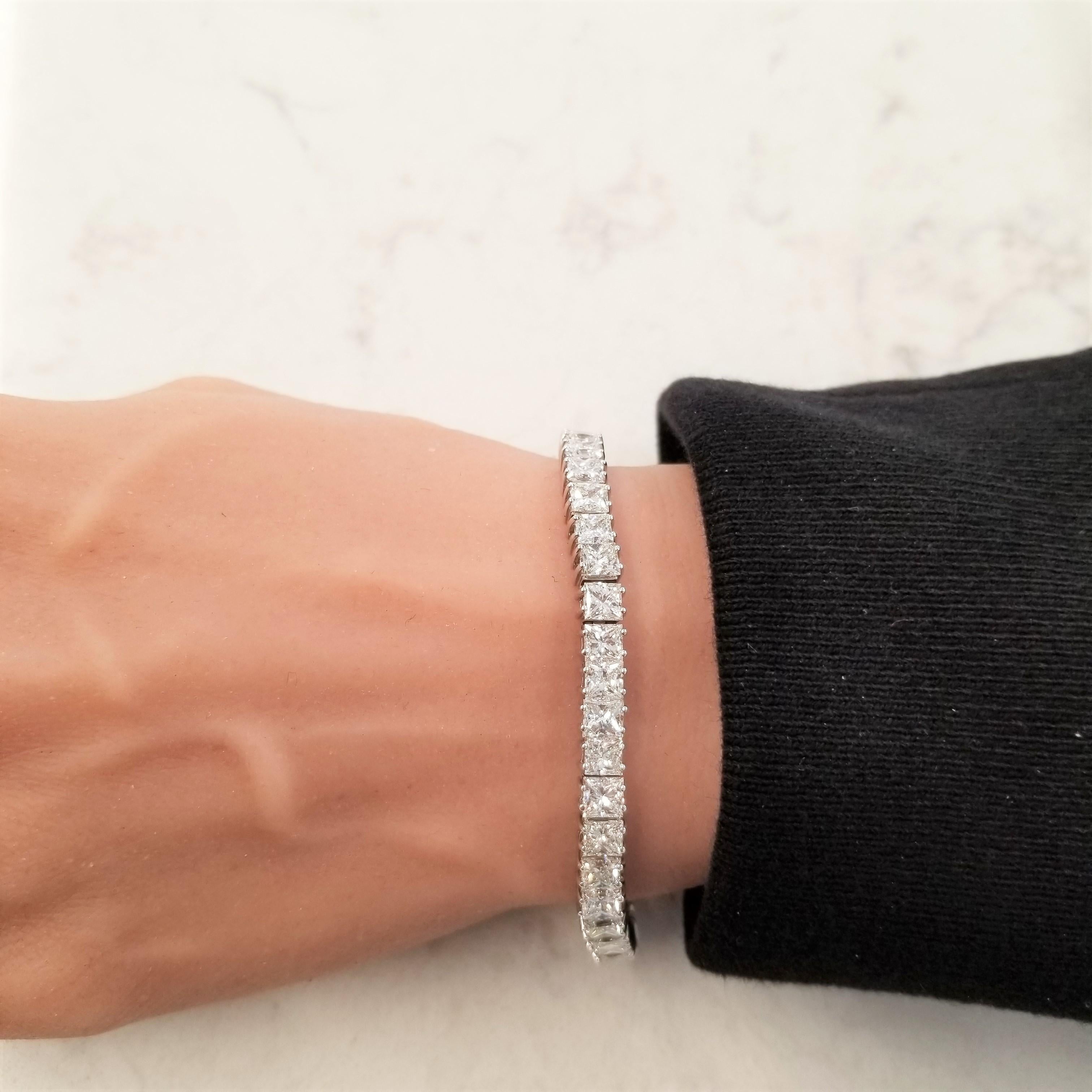 A bracelet fit for a princess, or your queen! Luxuriously fashioned of high-quality 18 Karat white gold, this spectacular Tennis bracelet is elegant enough to be worn at any Hollywood red-carpet event. This bracelet features an astounding 20.66