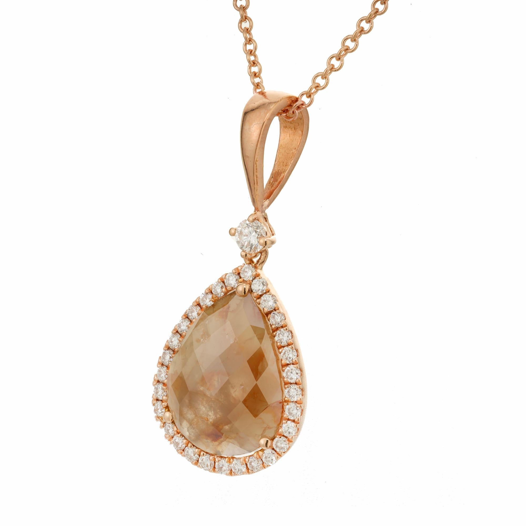 Natural pink brown color diamond slice pendant necklace. 1 pear slice pink/brown diamond slice with a halo of round white diamonds, accented with one round diamond on the bail.  The 16 inch chain is 18k rose gold and the pendant is 14k rose gold
