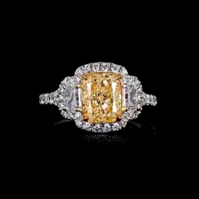 Art Deco EGL Certified 2.18 Carat Fancy Intense Yellow VS1 Cushion Halo Diamond Ring For Sale