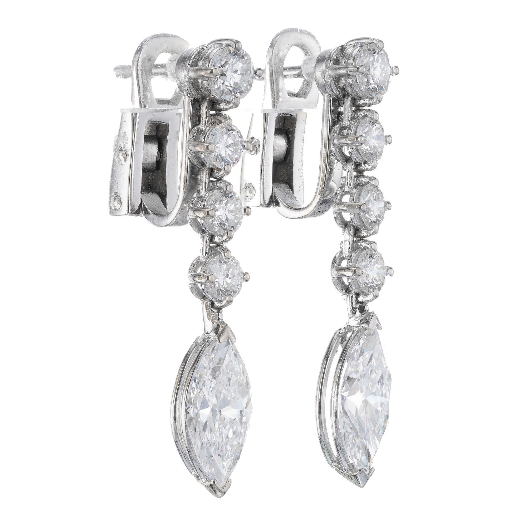 Round and marquise diamond dangle drop earrings in 18k white gold. EGL Certified 

2 marquise cut diamonds F-G SI I, approx. 2.20tcw EGL Certificate #US400132122D
8 round brilliant cut diamonds G VS-SI, approx. .90cts
18k white gold 
Stamped: