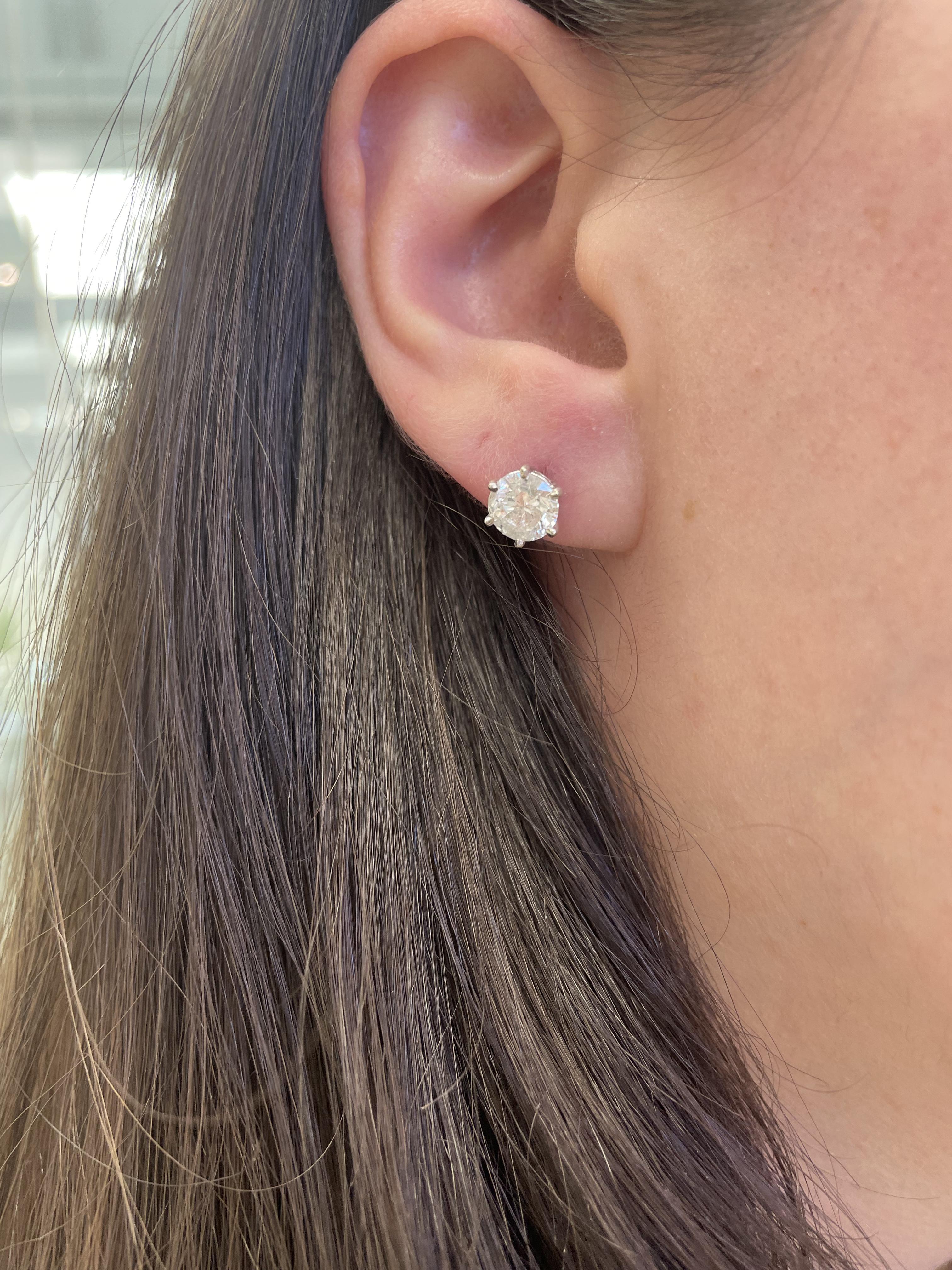 Classic diamond stud earrings, each stone EGL certified.
Two matching round brilliant diamonds 2.38 carats total. Both stones G color grad and I1 clarity grade. Six prong setting, 14k white gold, 1.45 grams.
Accommodated with an up-to-date digital
