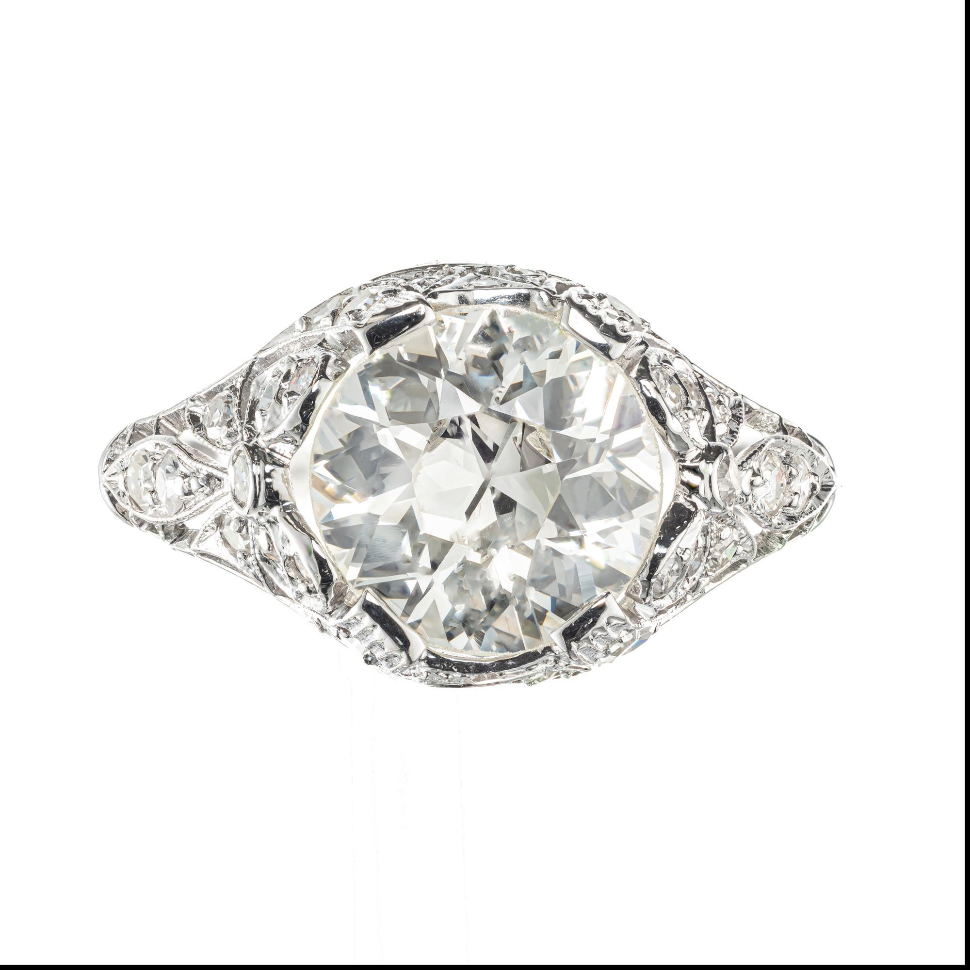The old mine brilliant cut diamond engagement ring. Circa 1900’s old European center diamond accented with 32 single cut diamond in a platinum setting with bow design sides. EGL certified. 

1 old European brilliant cut diamonds, approx. 2.48cts I-J