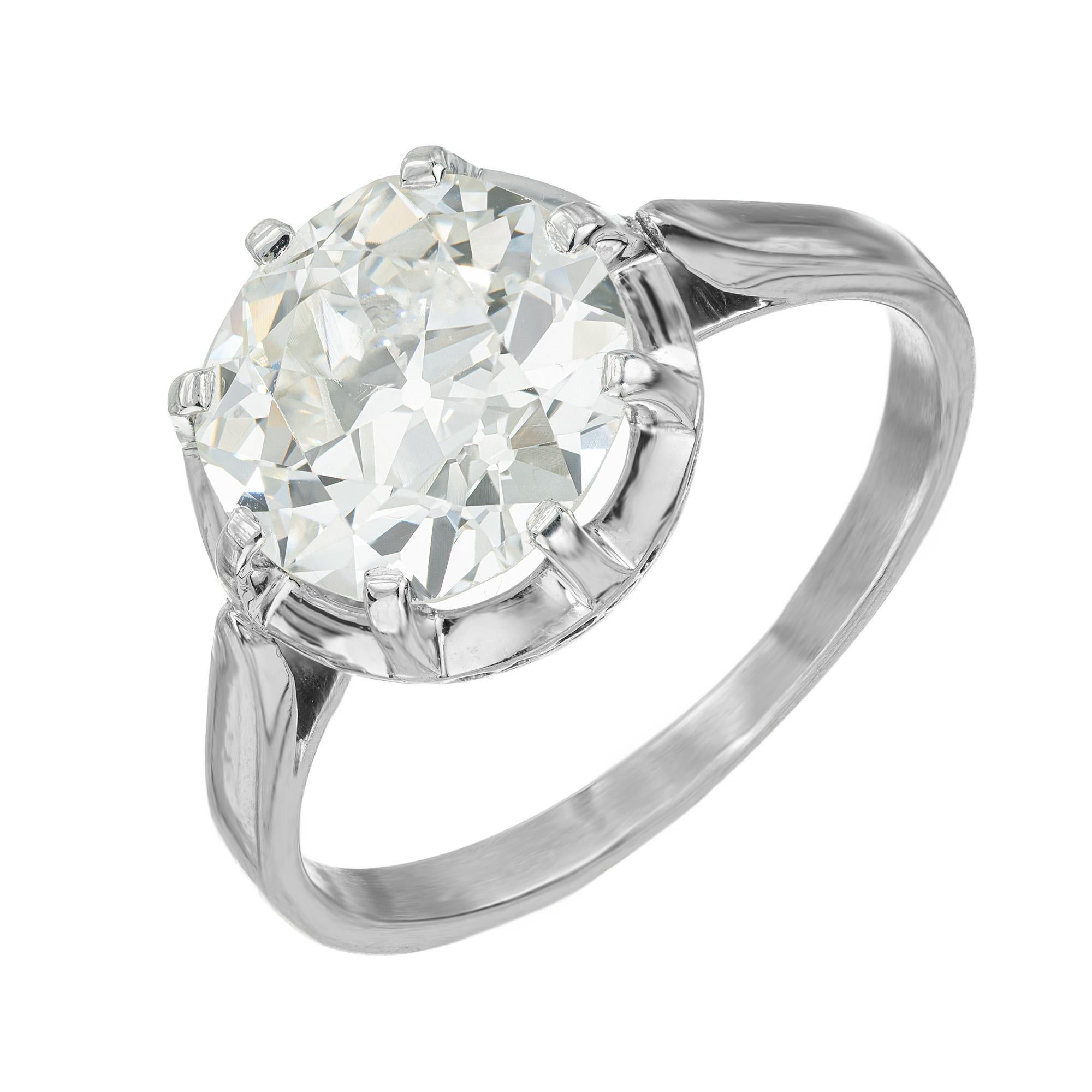Experience the timeless elegance of this 1930's Art Deco diamond engagement ring. Set with a round transitional cut 2.50ct center diamond, secured by an eight prong setting, this masterpiece radiates with vintage charm. This exquisite ring is a true