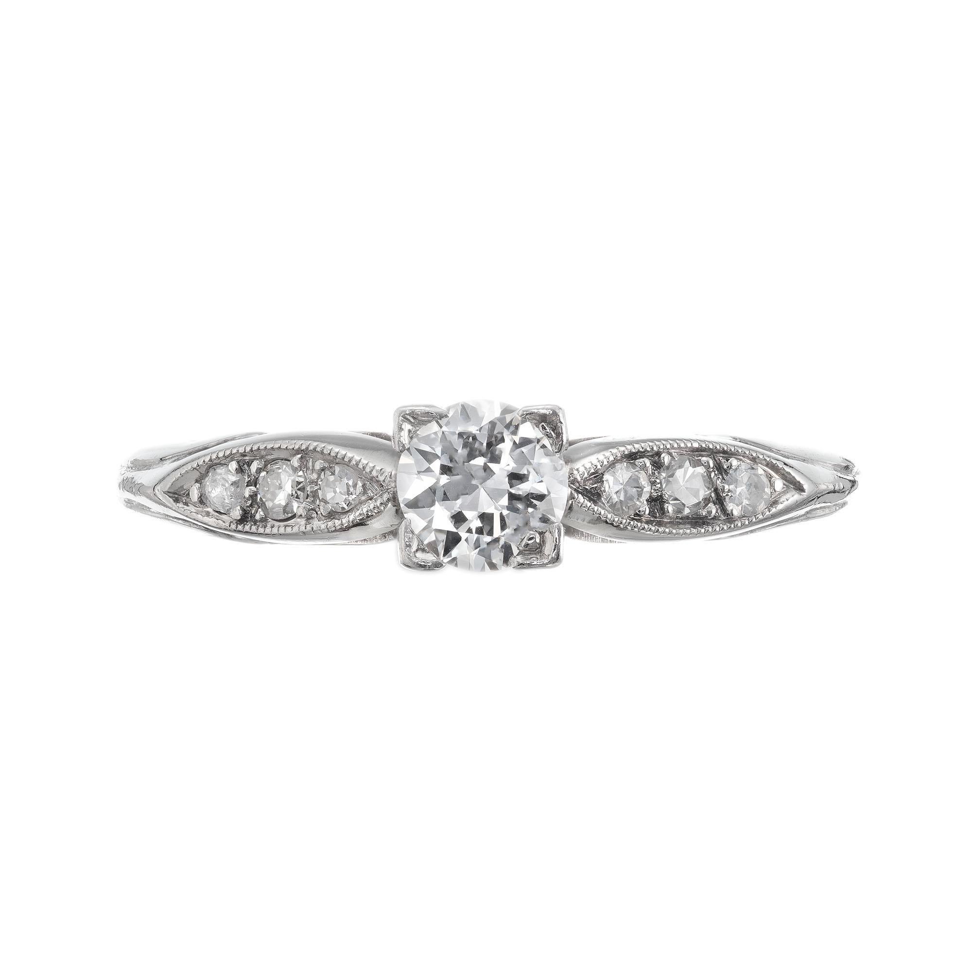 1940's late Art Deco transitional diamond engagement ring with six side diamonds in it's original platinum setting. EGL certified. 

1 Transitional brilliant cut diamond, approx. total weight .26cts, E, VS2, Depth: 57.3%, Table: 62%. EGL #