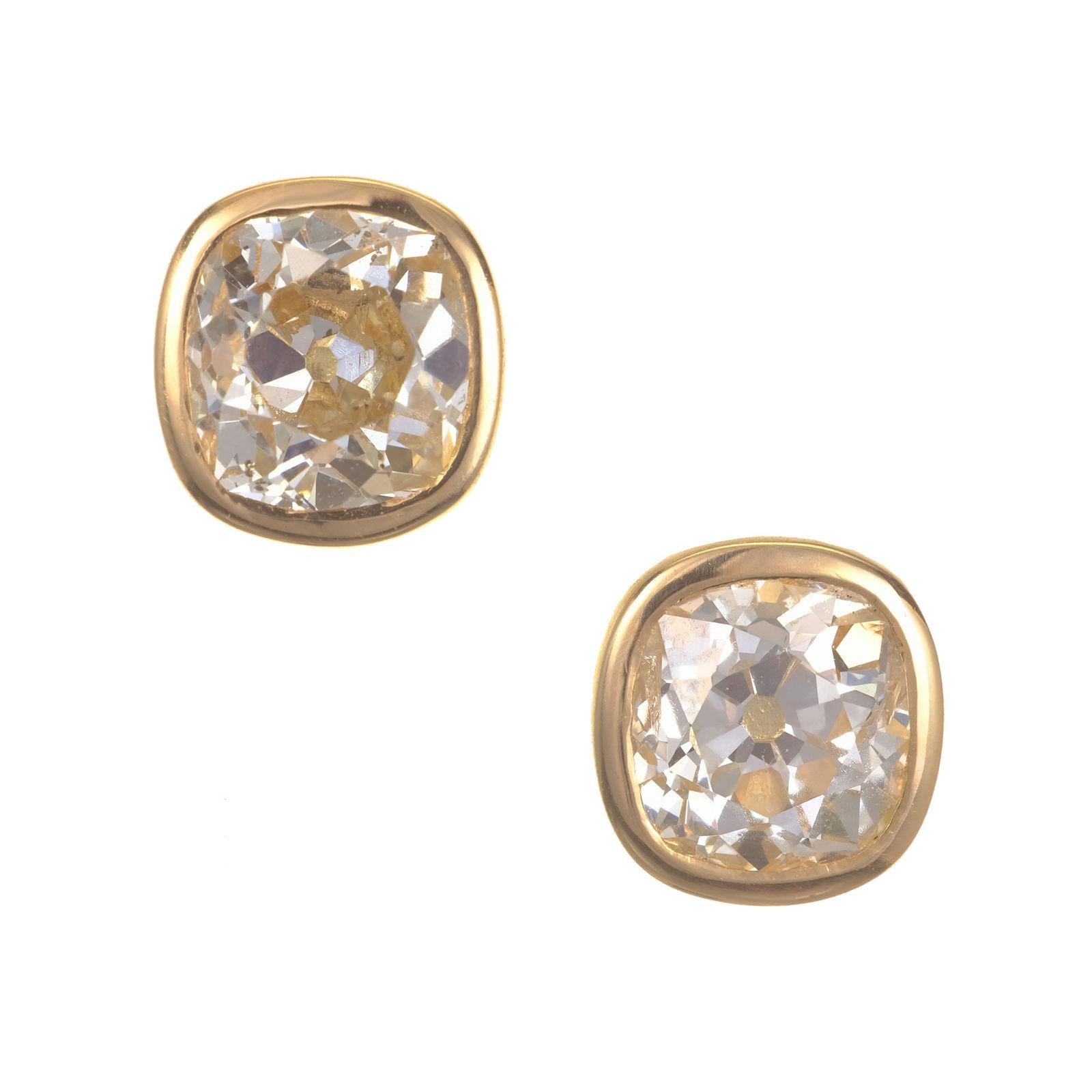 Old mine brilliant cut diamond stud earrings. 2 Old mine cut diamonds totaling 2.91cts, bezel tube set in 18k yellow gold settings. EGL has graded them as faint to very light yellow color. 

1 Old Mine Cut Diamond Approx. Total Weight 1.46 carats
