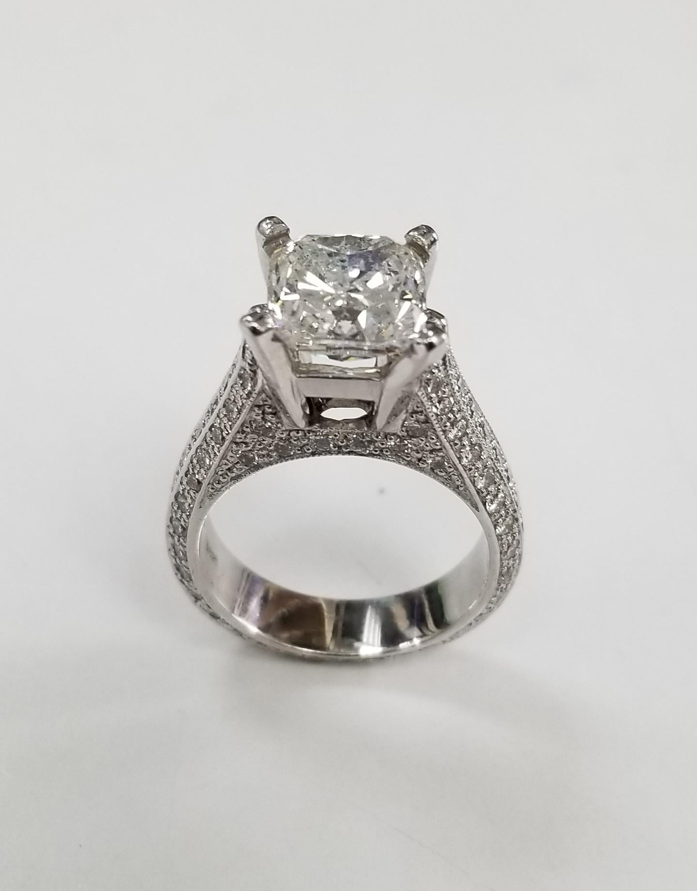 EGL Certified 3.06 carat Cushion cut Diamond E Si3 (US 918748207D) set in a 14k wg pave' setting, containing  60 round full cut diamonds of very fine quality weighing .66pts. ring is a size 6.25 and can be sized to fit for free. 