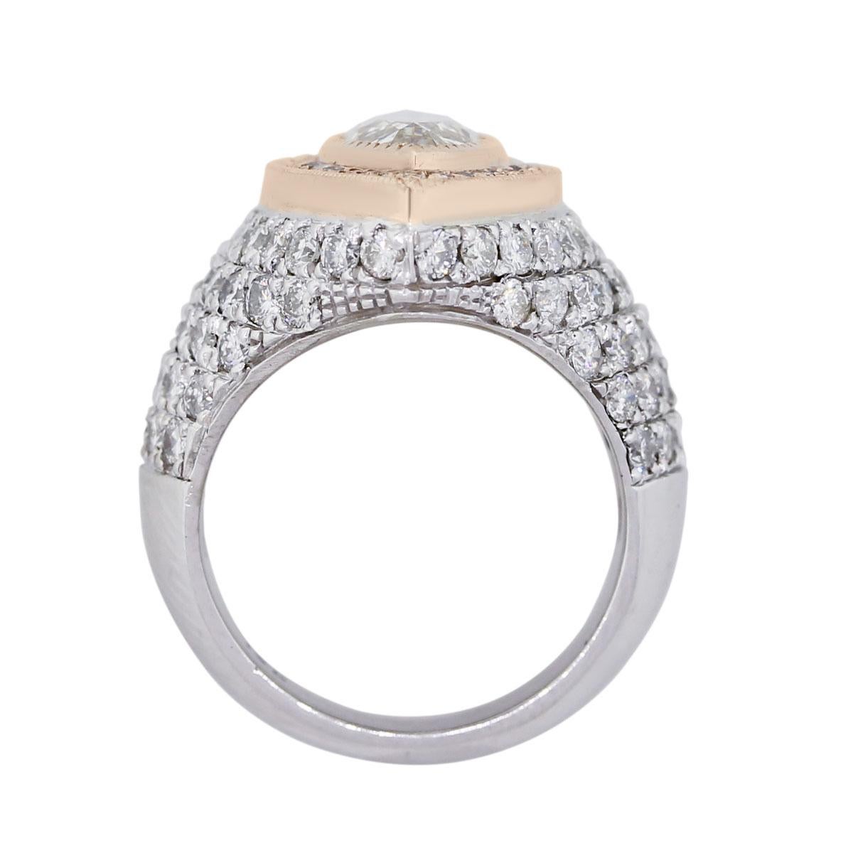 Material: 14k white and rose gold
Center Diamond Details: EGL certified 3.06ctw marquise shape diamond. Diamond is K in color and SI3 in clarity. EGL cert. #US76981801
Additional Diamond Details: Approximately 2.79ctw of round brilliant