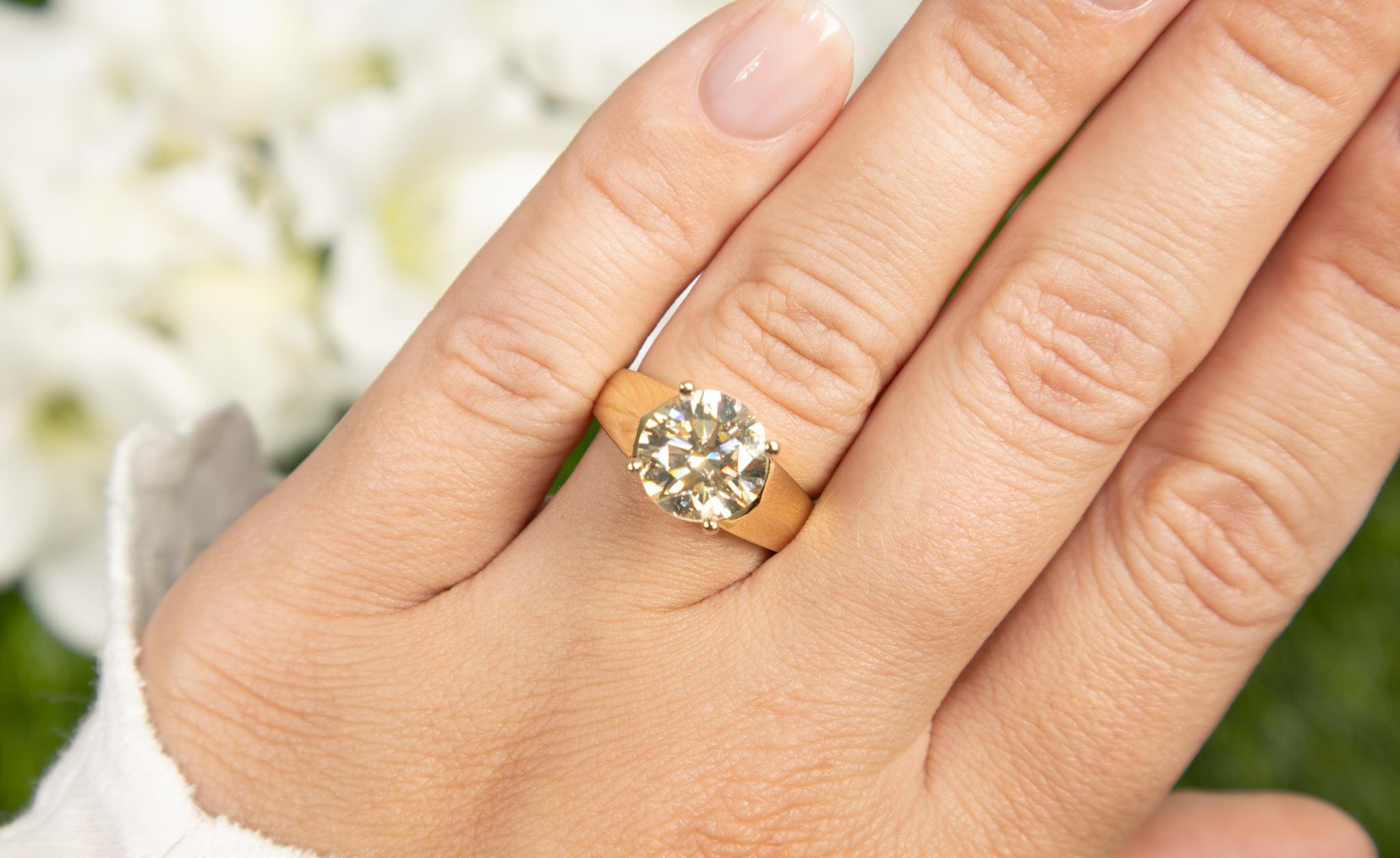 It comes with the EGL Certificate 
All Gemstones are Natural
Diamond = 3.19 Carats
Cut: Round, Color: L, Clarity: VS1
Metal: 14K Yellow Gold
Ring Size: 6.25* US
*It can be resized complimentary