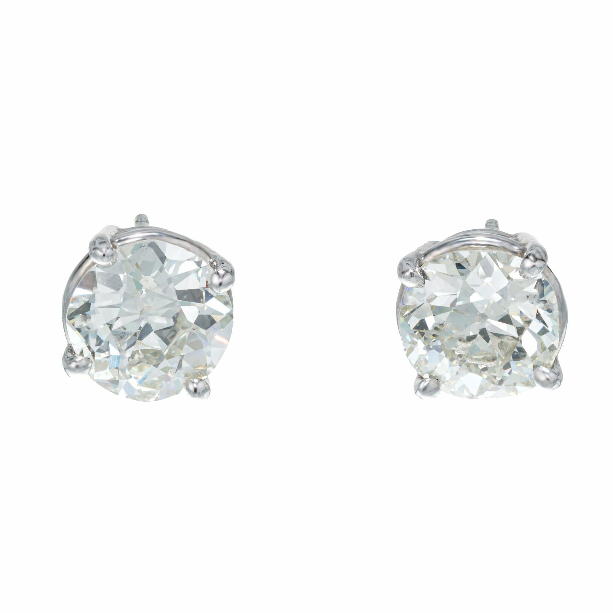 Well matched Old European cut diamond stud earrings. 2, EGL certified I-J (near colorless) round diamonds totaling 3.35cts. Set in simple 4 prong platinum settings. Both stones have equally beautiful with matching brilliance.

1 Old European