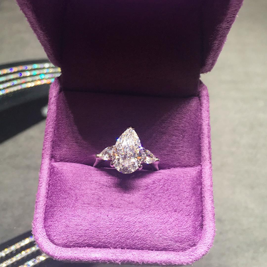 GIA Certified Pear Cut Diamond 3 Carat Three Stone Ring 

The main stone weights 3 carats but looks bigger is 12.21 mm long!