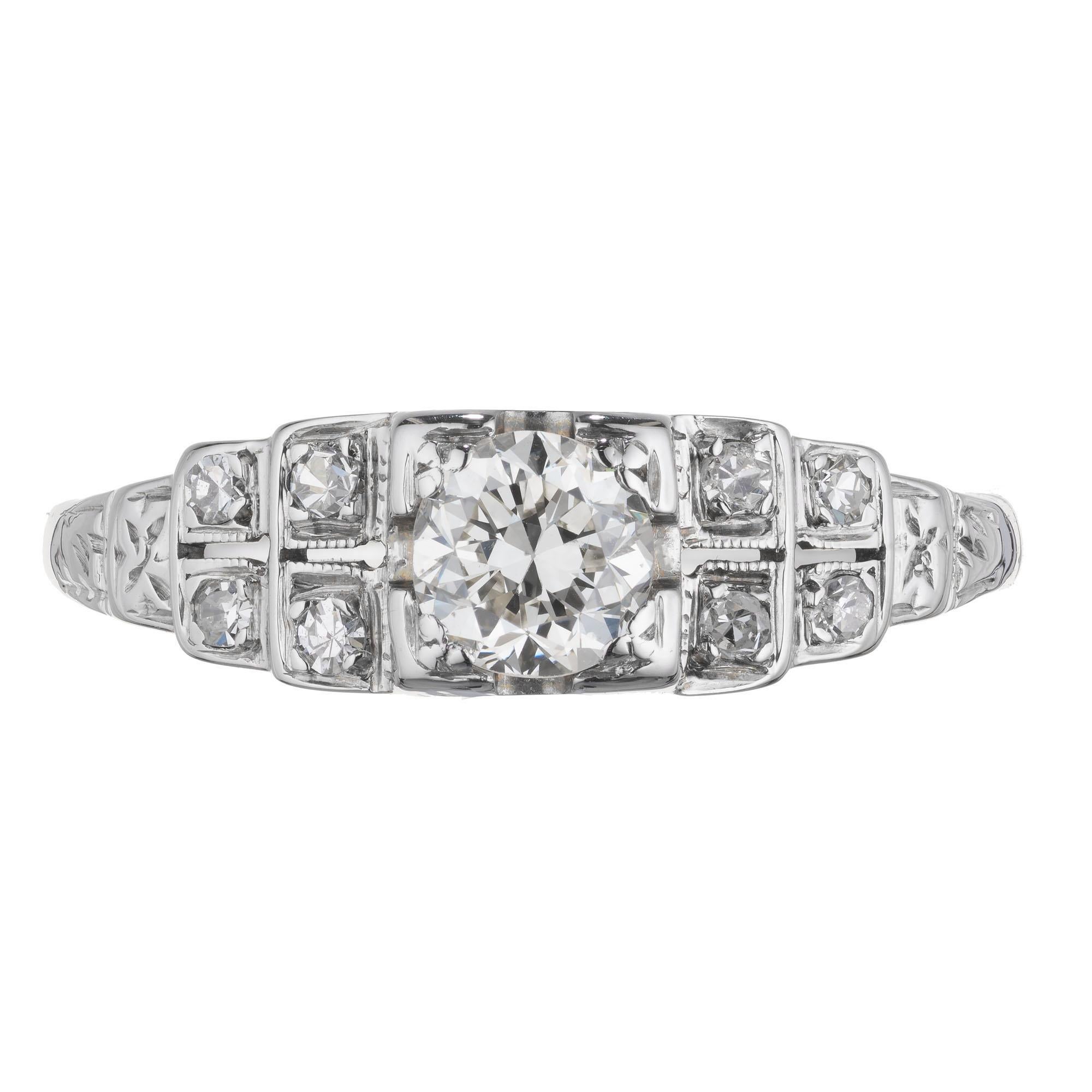 1940's Art Deco style diamond engagement ring. 14k white gold, EGL certified center stone with 8 single cut accent diamonds in a 14k white gold setting. 

1 round brilliant cut diamond I-J VS2, approx. .40ct EGL Certificate # US 400132121D
8 single
