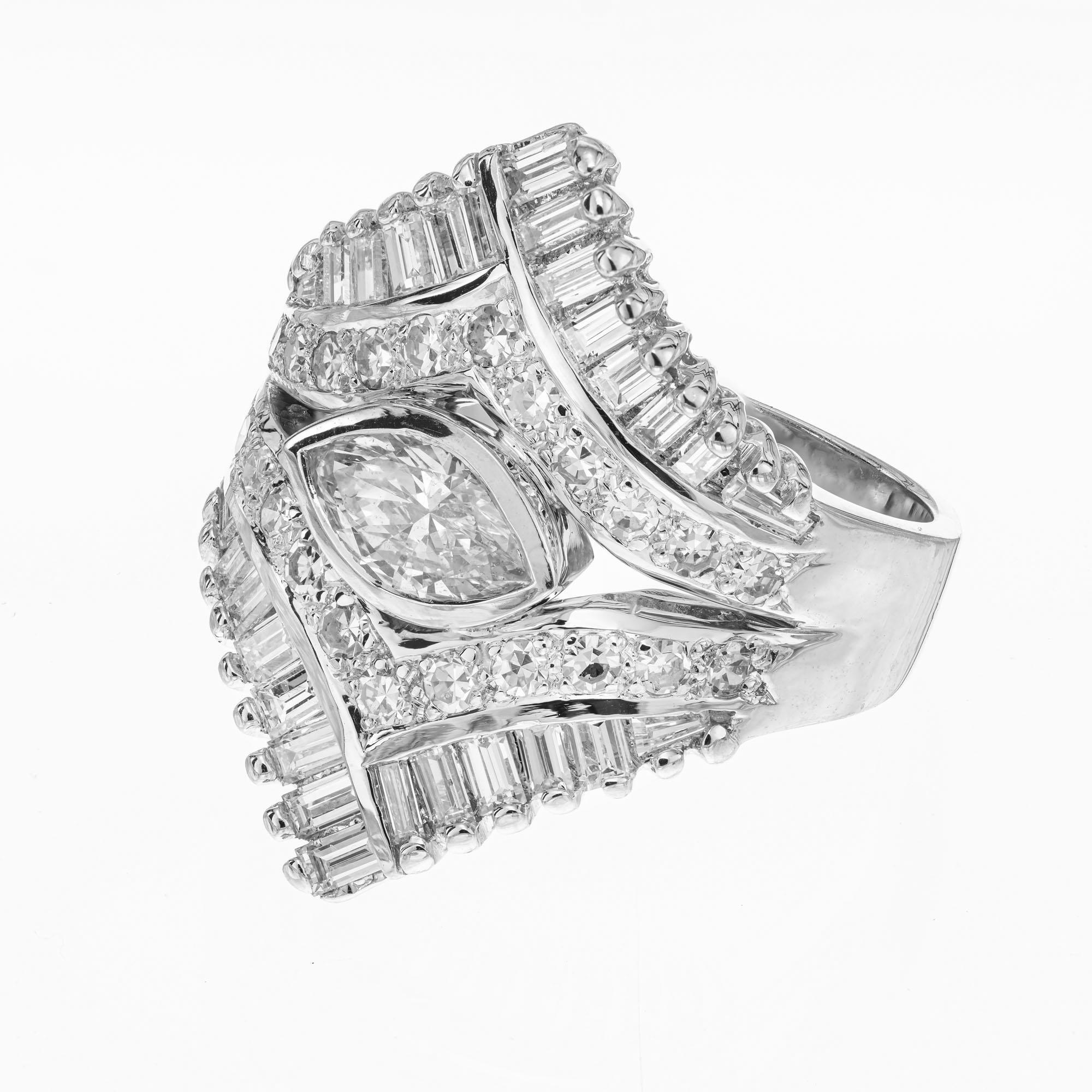 Vintage 1960's cluster cocktail or dinner diamond ring. EGL certified center marquise diamond accented by baguette and single cut diamonds in a 14k white gold setting. 

1 marquise cut diamond, F-G SI2 approx. .49cts EGL Certificate # 400145985D
28