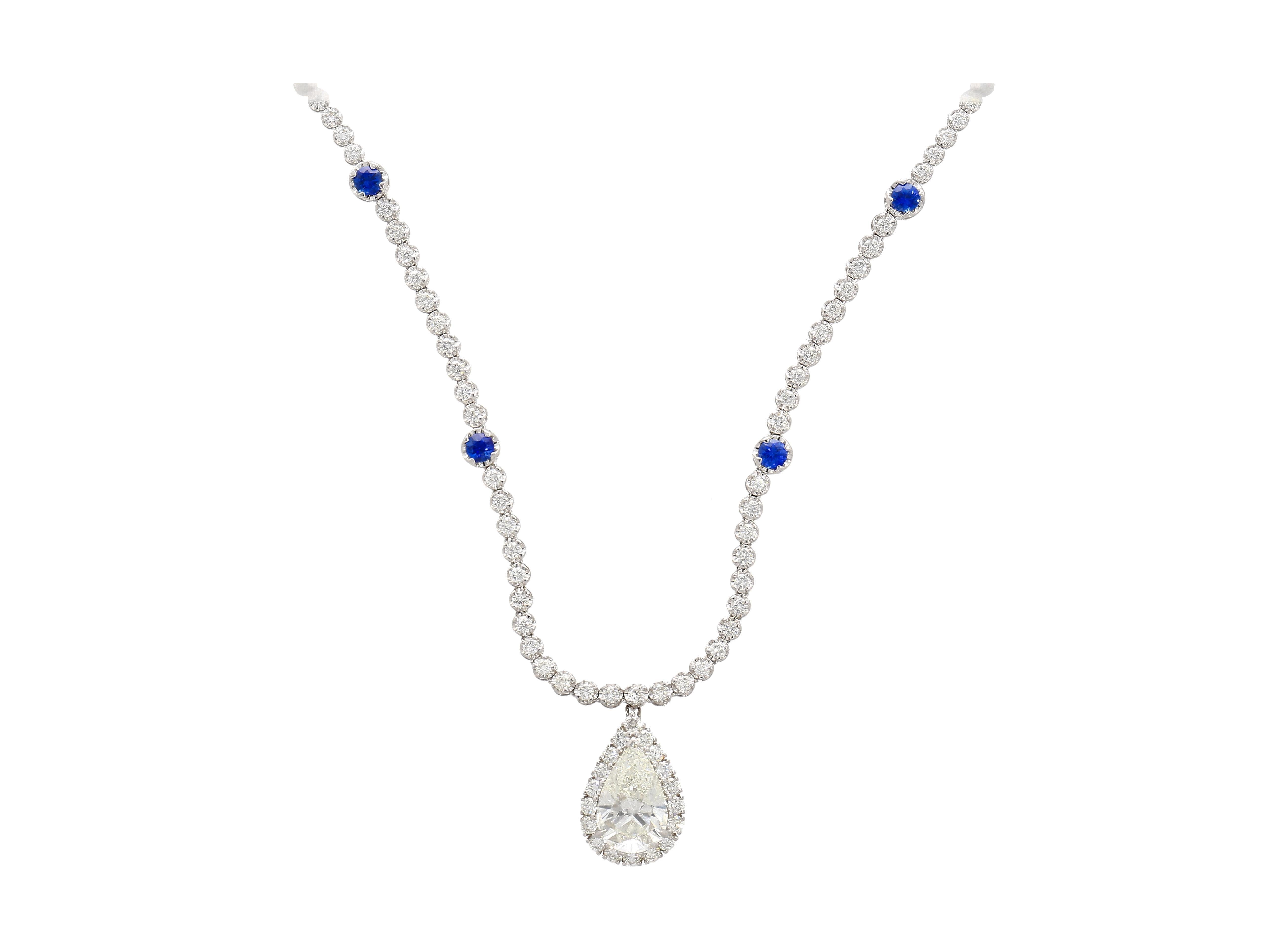 Women's EGL Certified 5.02 Carat Pear Diamond Pendant and Diamond Halo & Sapphire Detail For Sale