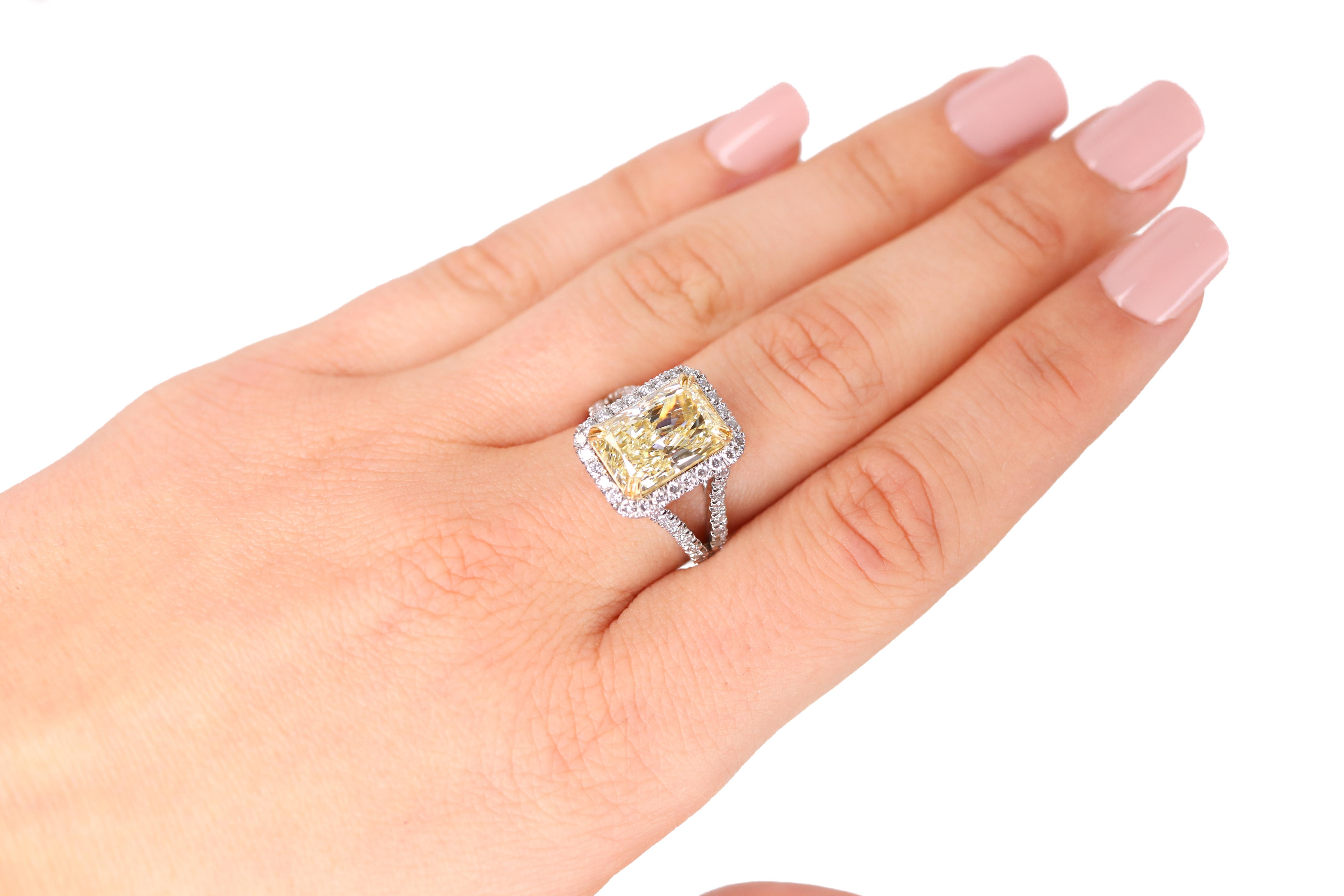 Women's EGL Certified 5.08 Carat Radiant Fancy Light Yellow Diamond Ring