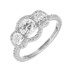 EGL Certified .52 Carat Three-Stone Diamond Halo Gold Engagement Ring