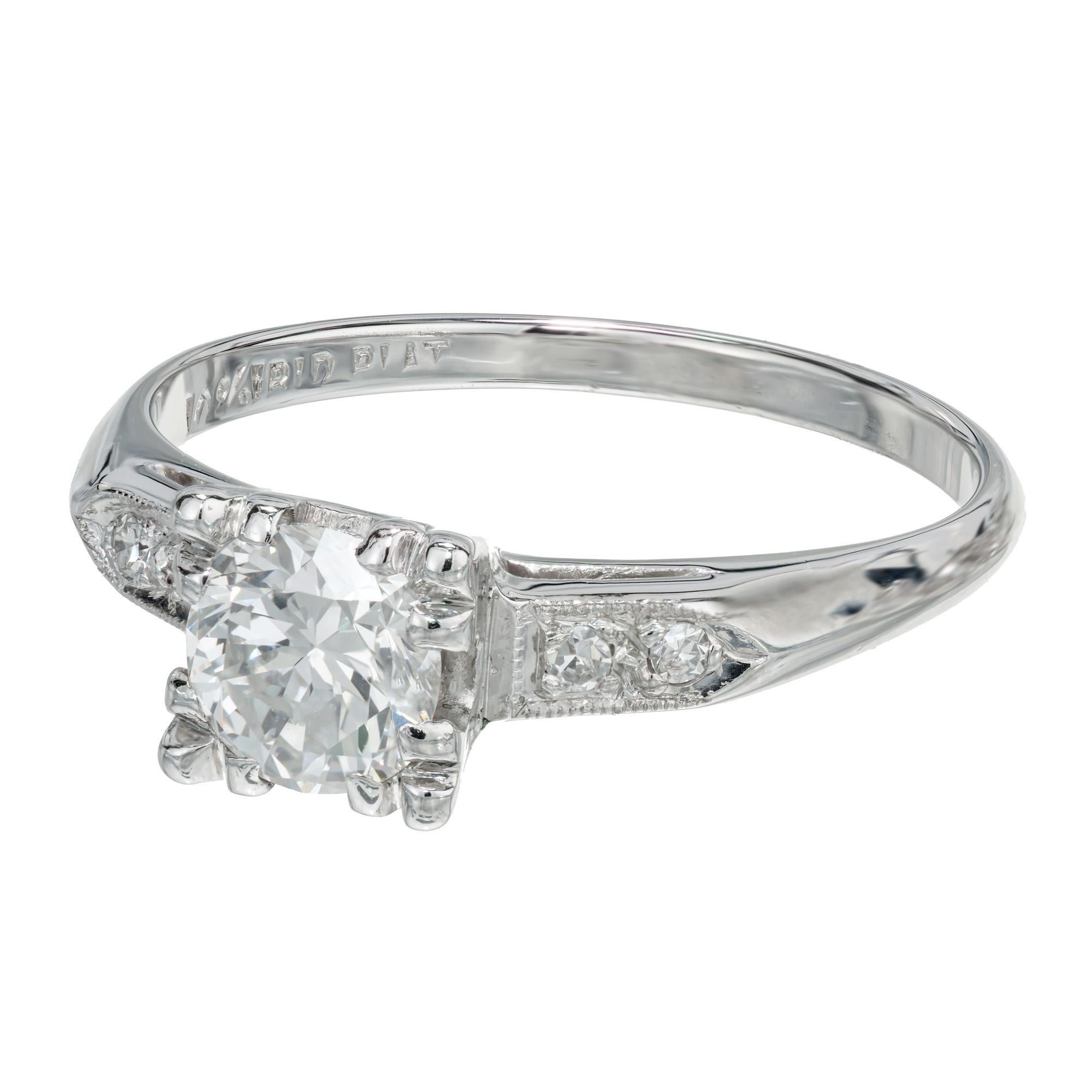 Classic 1940's square top diamond engagement ring. EGL certified center stone, is a brilliant round cut diamond, F-G (near colorless) and a VS2. Mounted in a solid platinum setting with 4 round cut accent diamonds along the shoulders. 

1 round