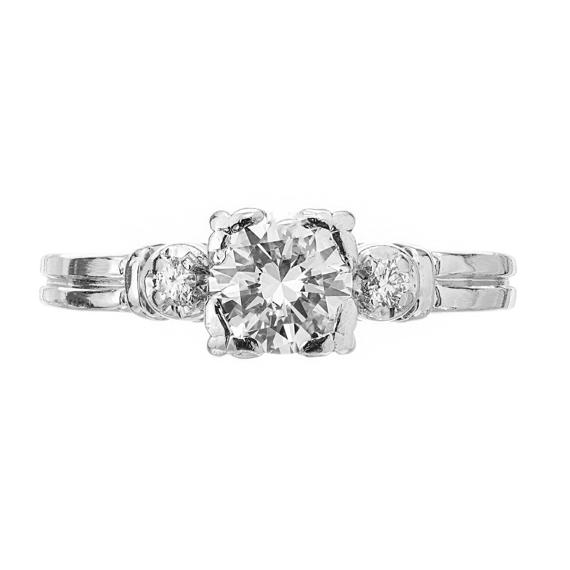 1950's handmade Diamond engagement ring. EGL certified round transitional ideal cut center stone in a platinum setting with 2 round full cut side diamonds.  

1 round transitional Ideal cut diamond, approx. total weight .63cts, E to F, VS1, 5.48 x