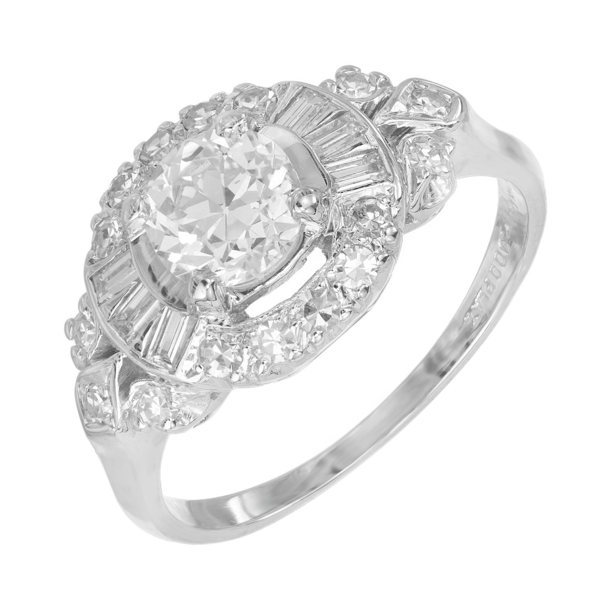 1930's Art Deco diamond engagement ring. Set with a .65ct old Euro transitional round brilliant cut diamond mounted in platinum setting with a halo of single cut and baguette diamonds. Each should is adorned with 3 singe cut diamonds as well. This