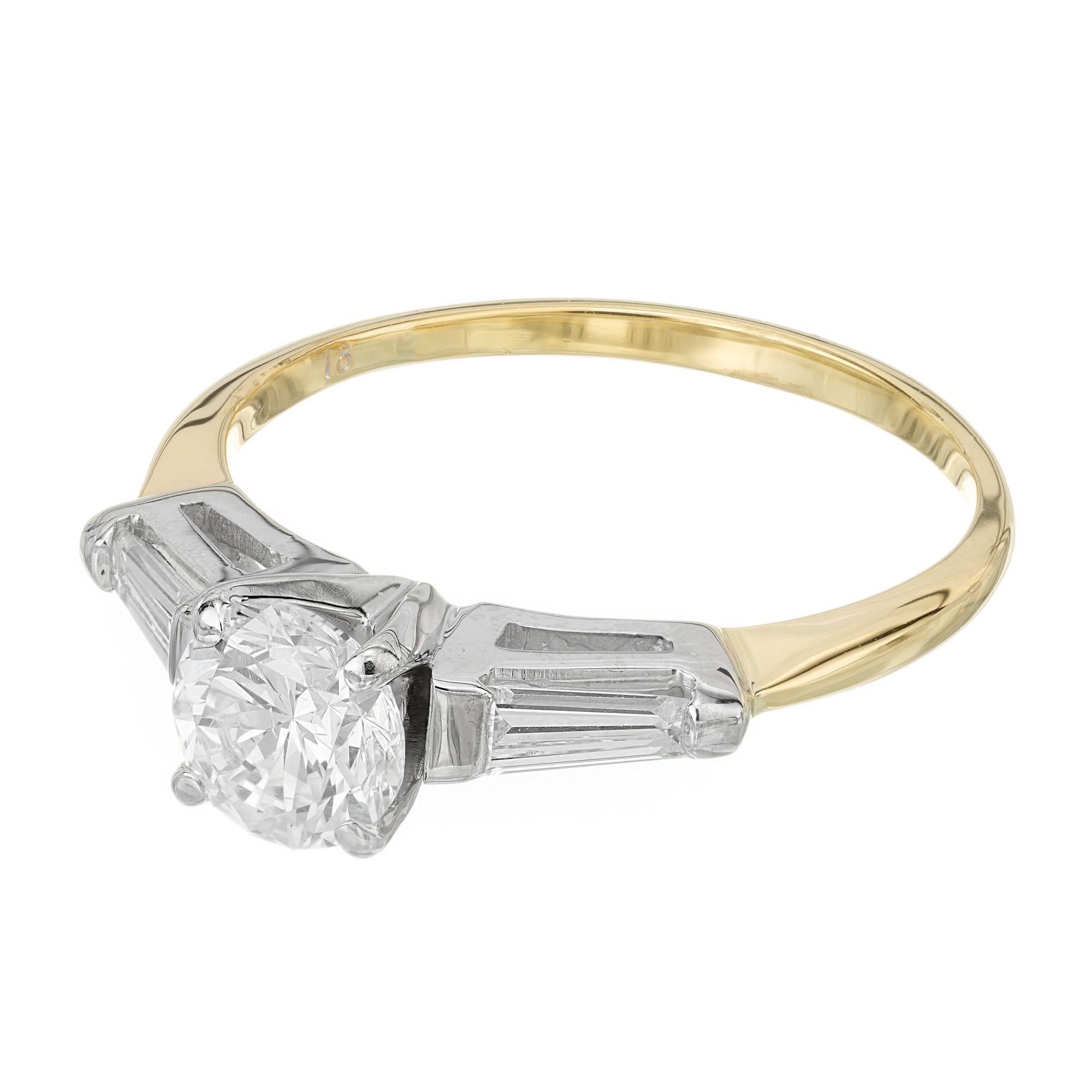1960's diamond engagement ring. EGL certified round center stone in a 18k white gold crown with two tapered baguette side diamonds in a 18k yellow gold setting.  

1 round brilliant cut diamond, E-F I1 approx. .73cts 5.69-5.64x3.70mm EGL Certificate
