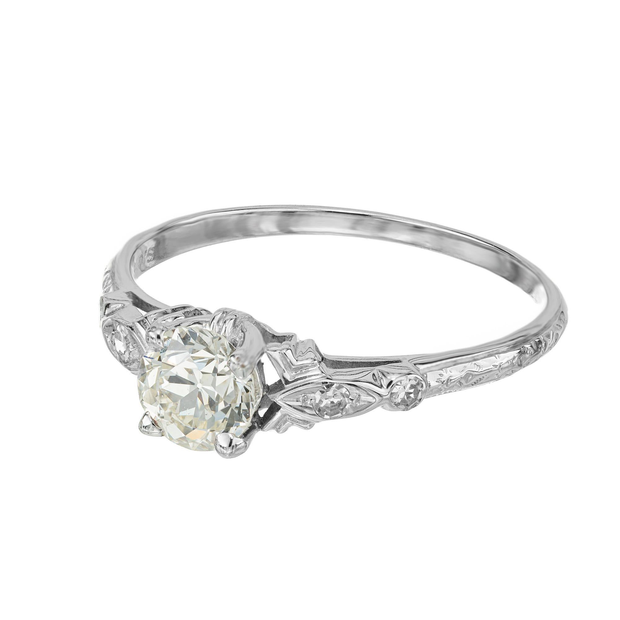 1930's Art Deco diamond white gold engagement ring. This exquisite ring features a dazzling .75 carat diamond, expertly cut to enhance its brilliant sparkle and fire. Accented with tow dingle cut diamonds on each side. The center stone is graded by