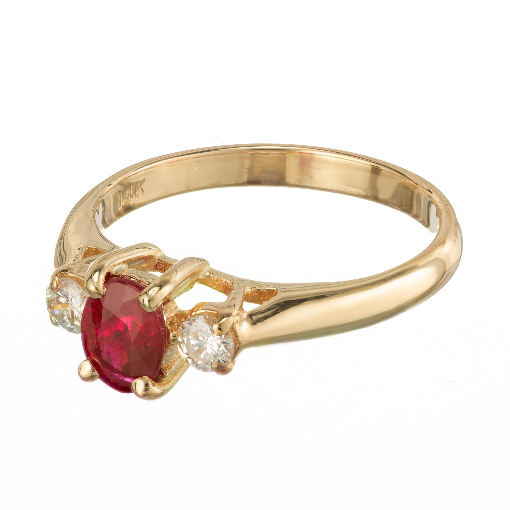 Oval ruby and diamond three-stone engagement ring. EGL certified oval center stone with two bright sparkly full cut round side diamonds, in a 14k yellow gold setting. 

1 oval red SI ruby, Approximate .76cts EGL Certificate # US314323703C
2 round