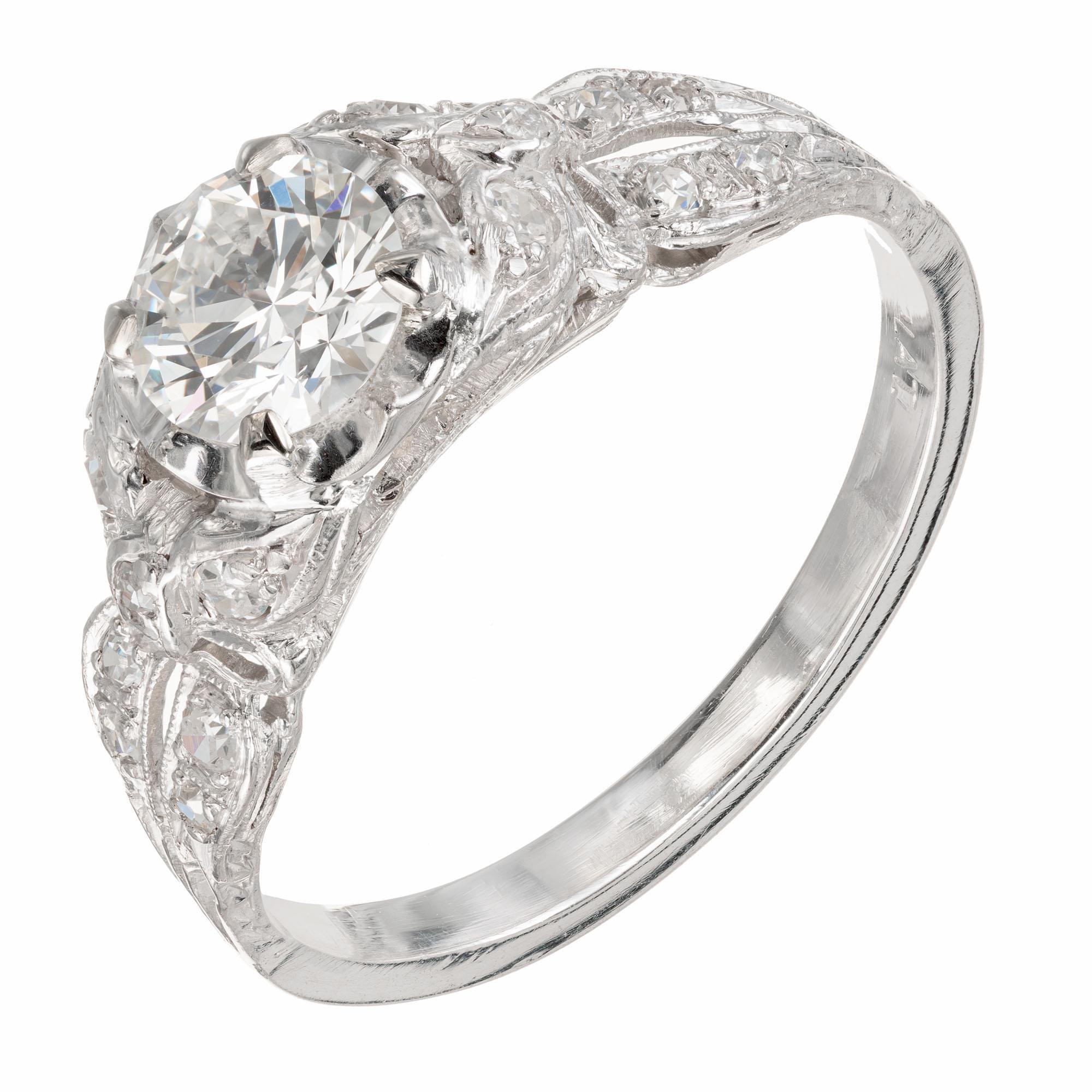 Art Deco platinum 1930's diamond engagement ring. Pierced engraved and pave set with a butterfly or bow design on each shoulder accented with 16 single cut brilliant diamonds. EGL certified 

1 round brilliant cut diamond, approx. .77cts H-I VS EGL