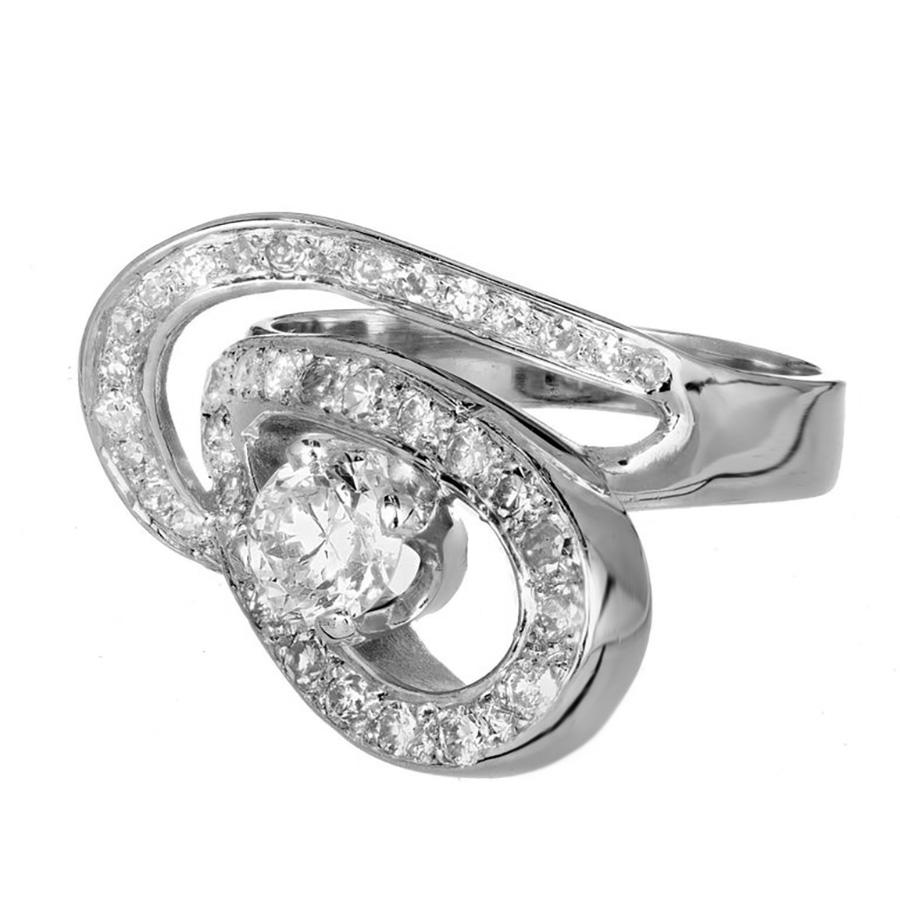 Discover the EGL certified 1950's .80ct diamond open swirl platinum double ellipse  cocktail ring, where elegance meets artistry. This exquisite ring features a brilliant sparkling .80 carat transitional brilliant cut center diamond, which is