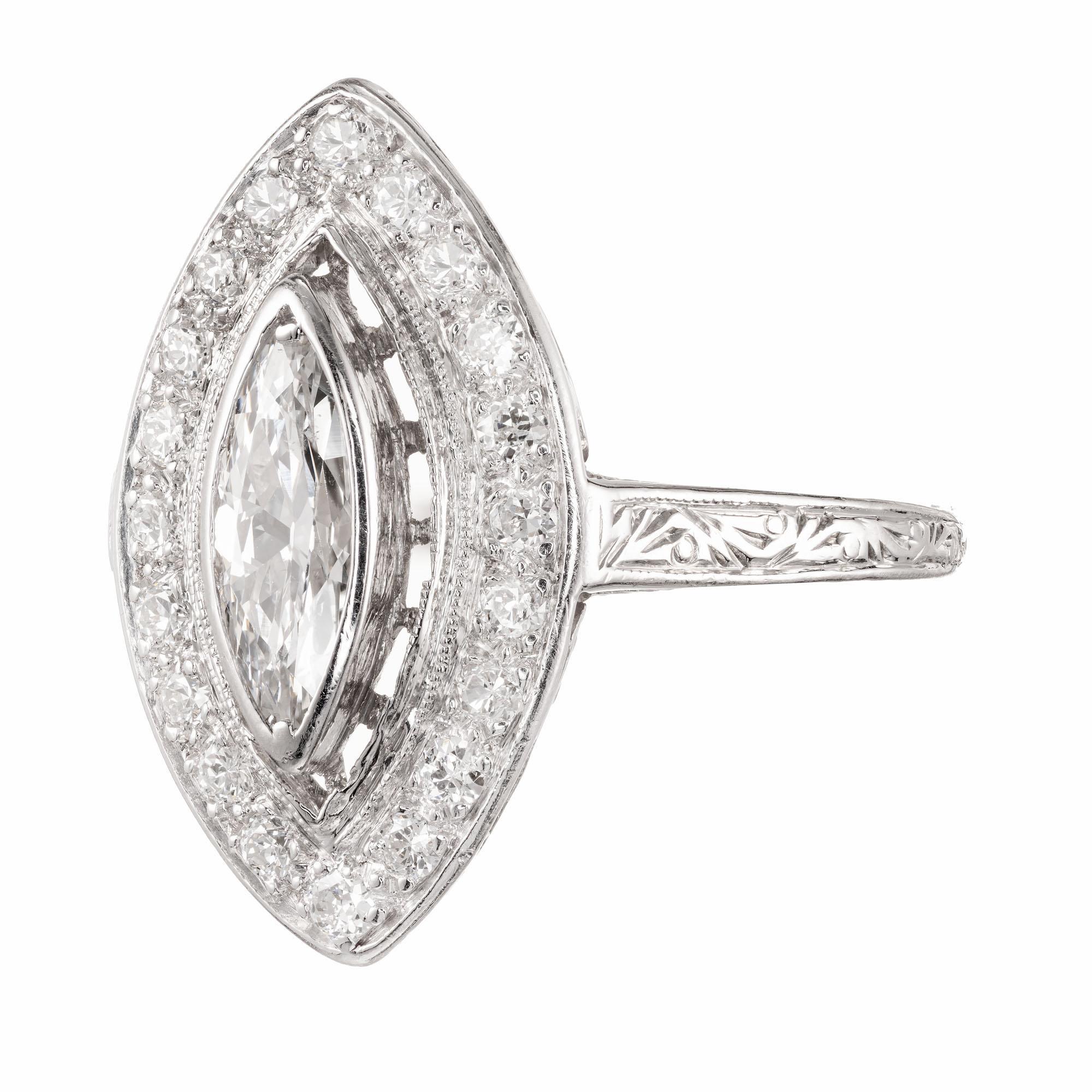 Handmade 1950's marquise diamond halo ring. EGL certified center marquise shape diamond, surrounded by round accent diamonds in a platinum setting. EGL Certified.

1 marquise diamond E-F SI, approx. .50ct EGL Certificate # US4001342470
20 round