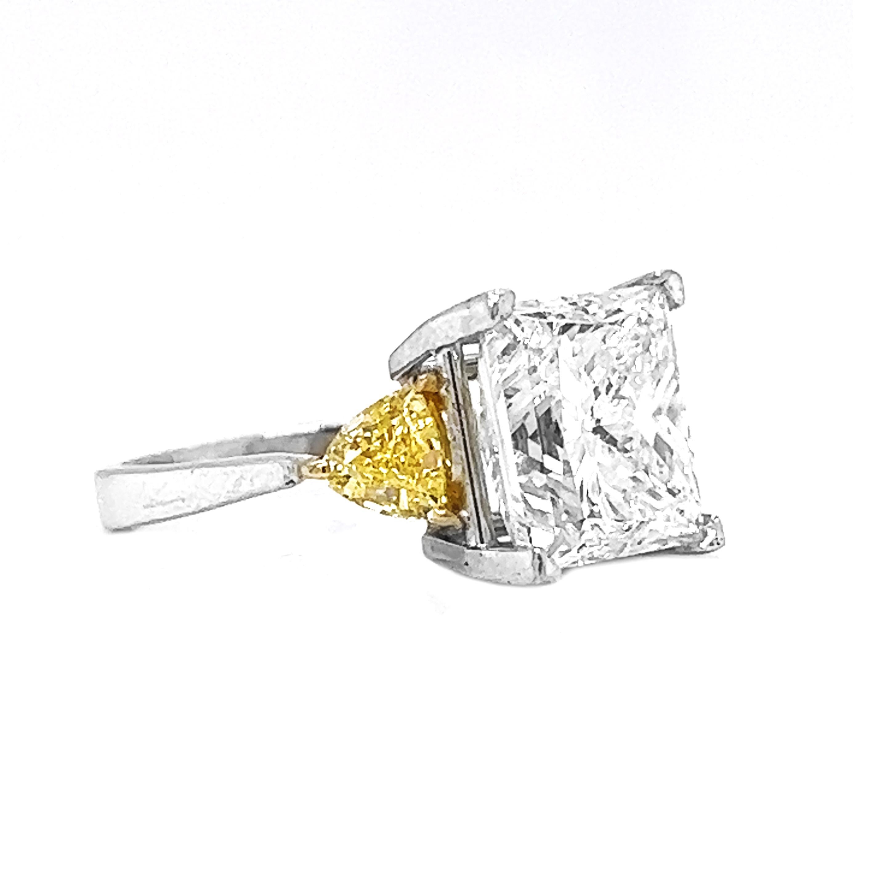 Introducing the EGL Certified 7.02 Carat Princess and Trillion Cut Diamond 3 Stone Ring in 18KT Gold, a masterpiece that radiates opulence and showcases the brilliance of rare and exquisite diamonds. Full of luster 

This exceptional ring features a