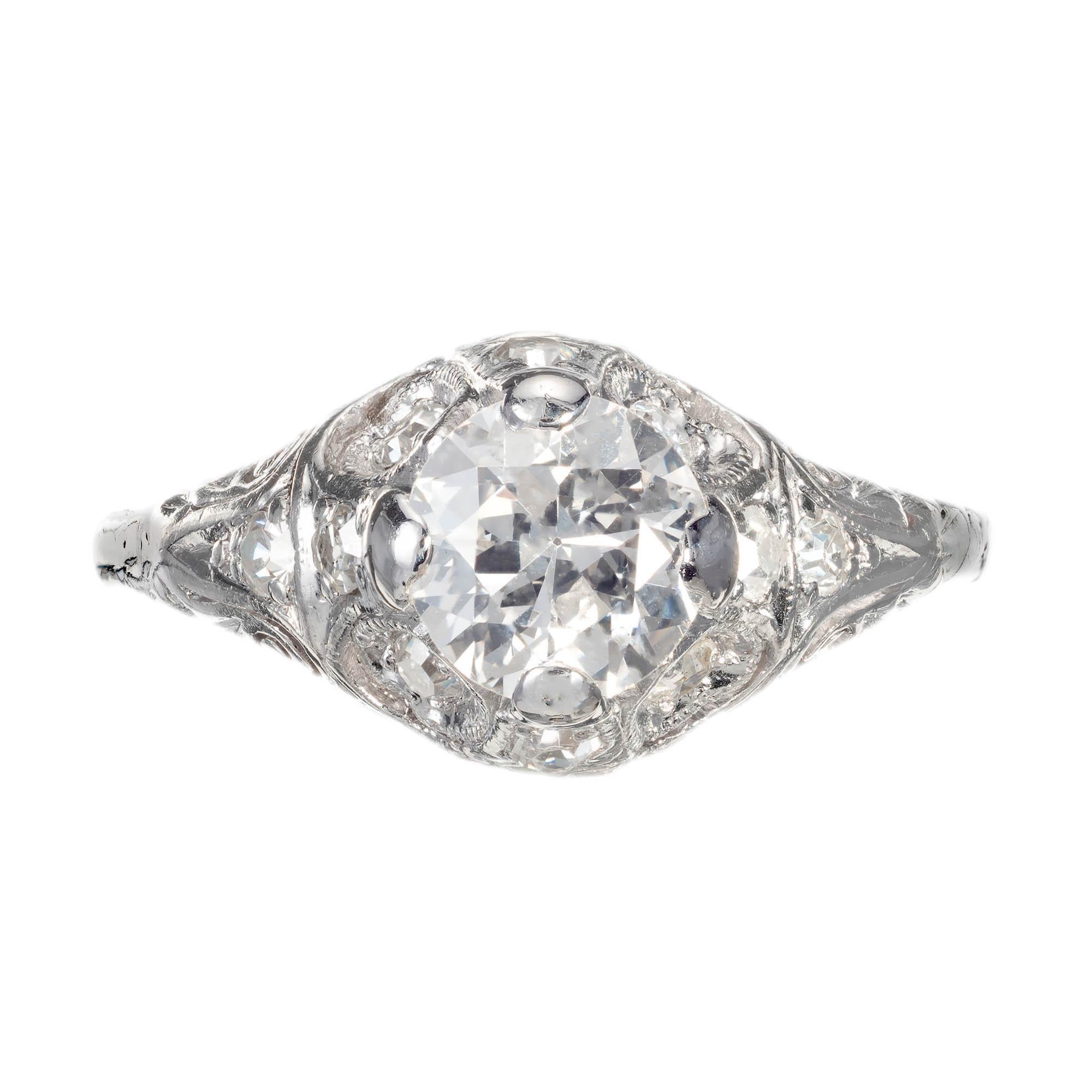 Diamond platinum engagement ring, with a transitional round stone set in the center of filigree setting, with accent diamonds around the higher end of the crown.   

1 transitional cut G-H SI2, approx. .82 carat EGL Certificate # US314571901D
10