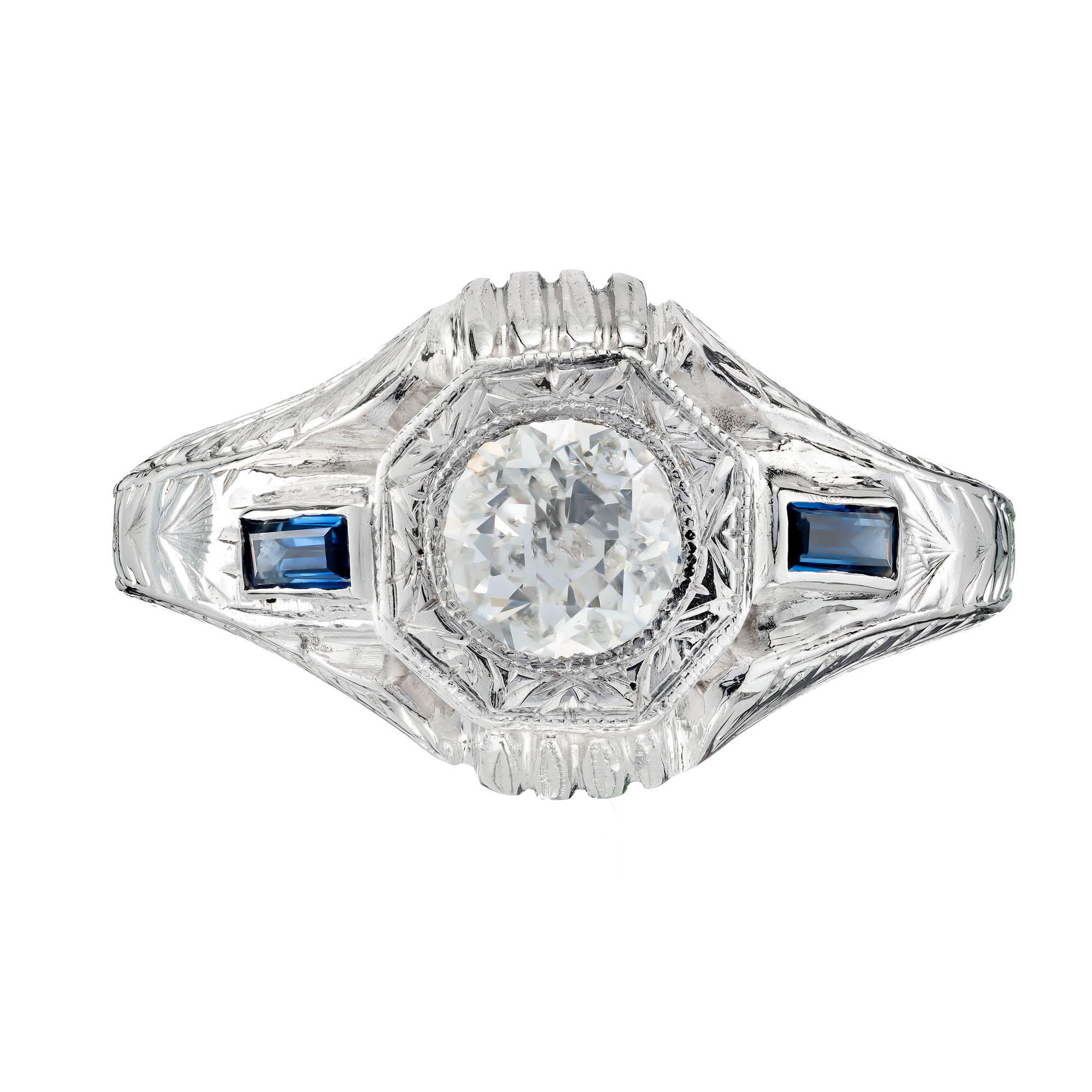 Diamond and sapphire original mens Art Deco style white gold ring. EGL certified Old European center stone with two baguette sapphire accent stones in a 14k white gold setting. Circa 1940-1950

1 Old European diamond F-G I, approx. .84ct EGL