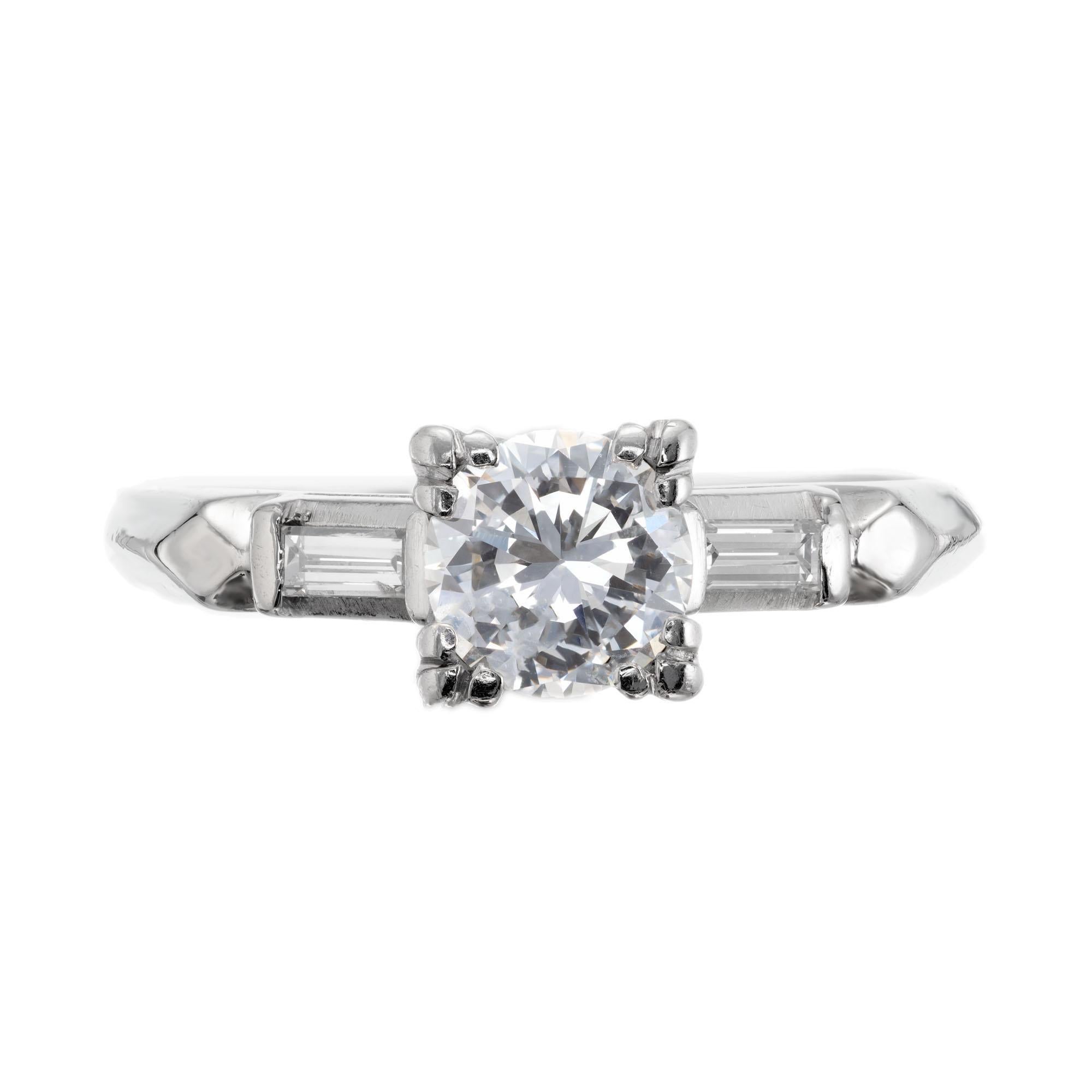Art Deco diamond engagement ring. Transitional cut round center diamond set in platinum, three-stone stetting with two straight baguette cut accent diamonds. EGL certified. 

1 transitional cut diamond, approx. total weight .79cts, E to F color and