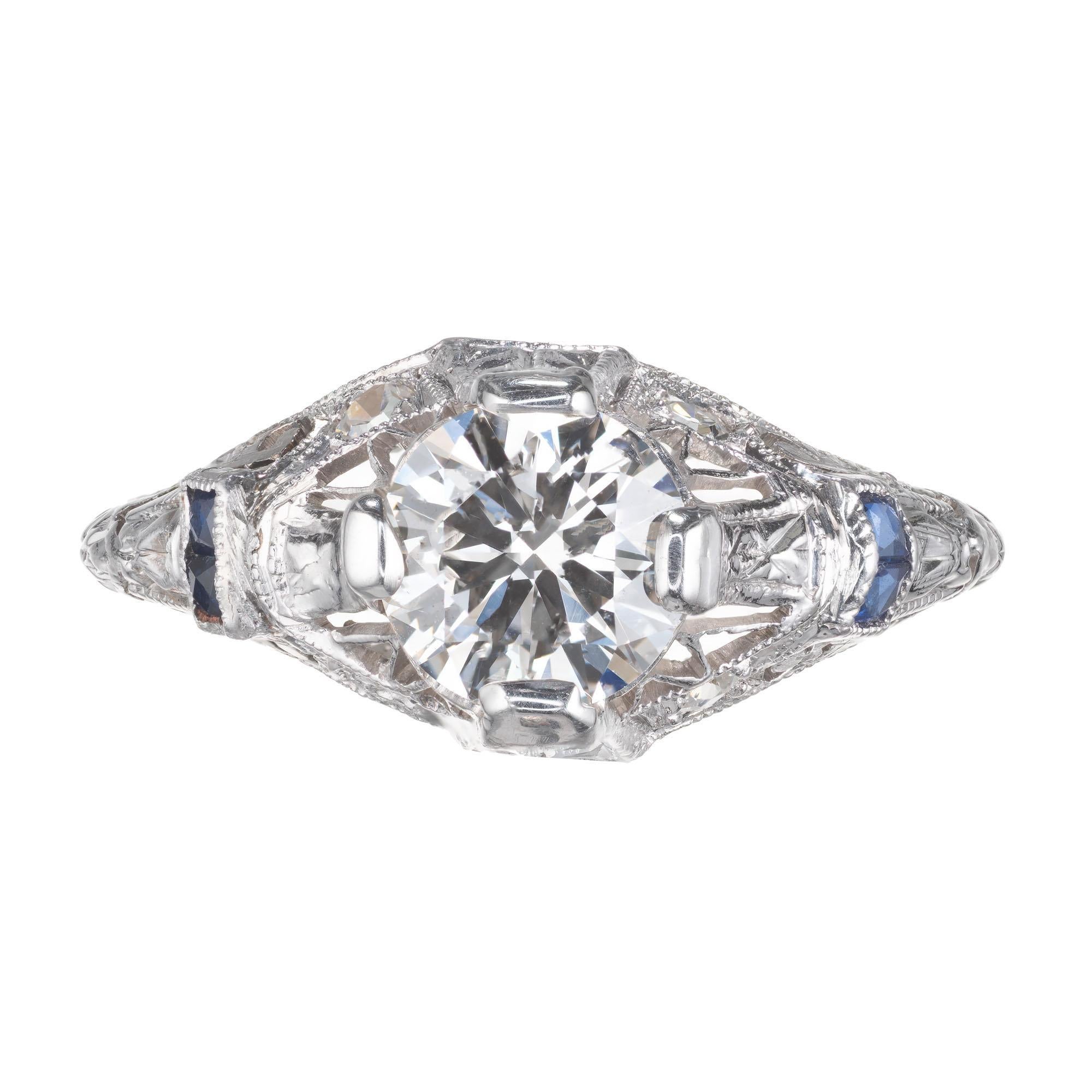 Estate transitional cut .92 carat 1940's diamond and sapphire filigree engagement ring. EGL certified center stone, set in platinum with single cut diamonds and french cut sapphires.  

1 round brilliant cut diamond F-G SI2, approx. .92ct EGL