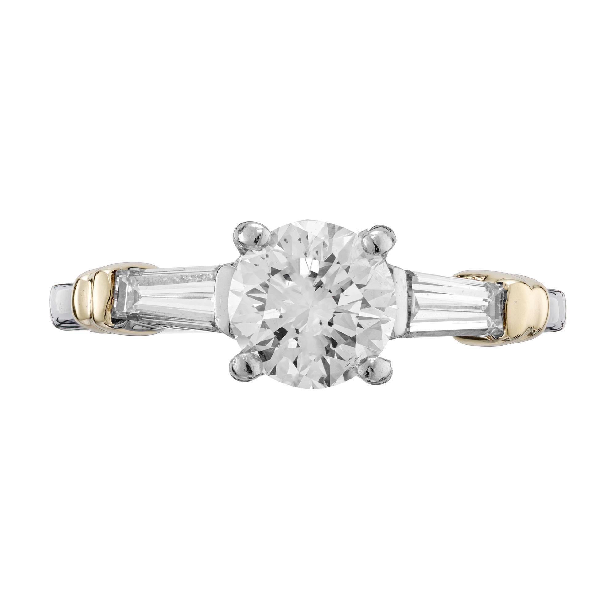 Diamond three-stone engagement ring. EGL certified .97ct round brilliant cut diamond center stone with 2 tapered baguette side diamonds, set in platinum and 18k yellow gold.  

1 round diamond approx. total weight .97cts, I-J, SI1, 6.29 c 6.28 x